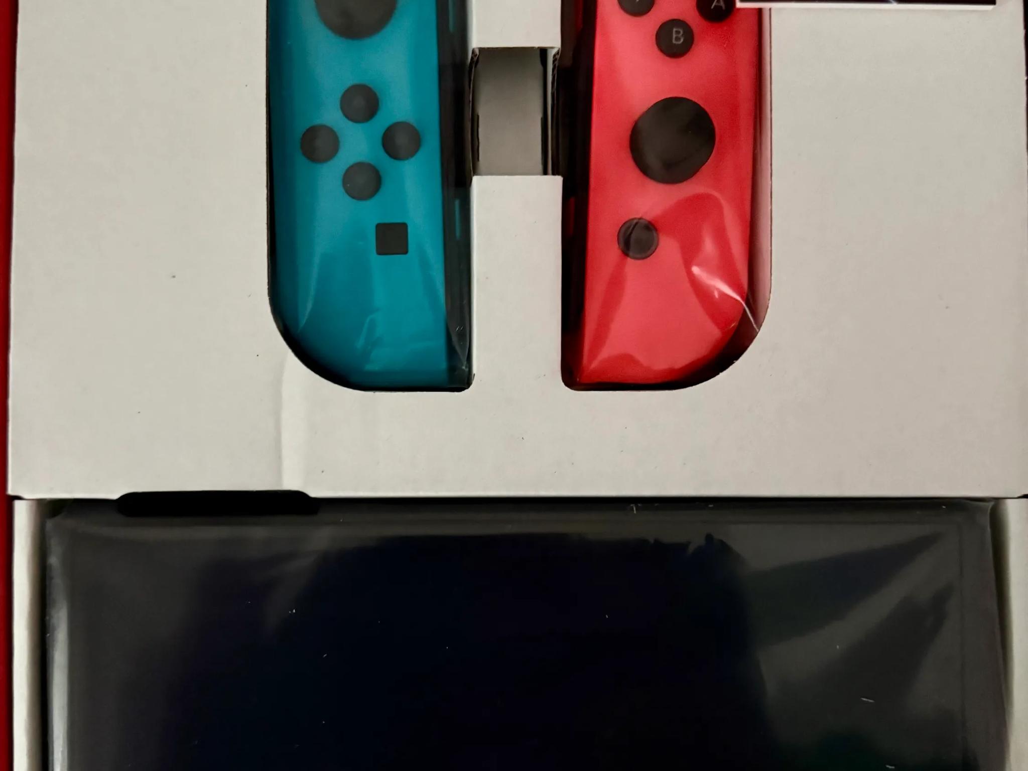Nintendo Switch – OLED Model w/ Neon Red & Neon Blue Joy-Con