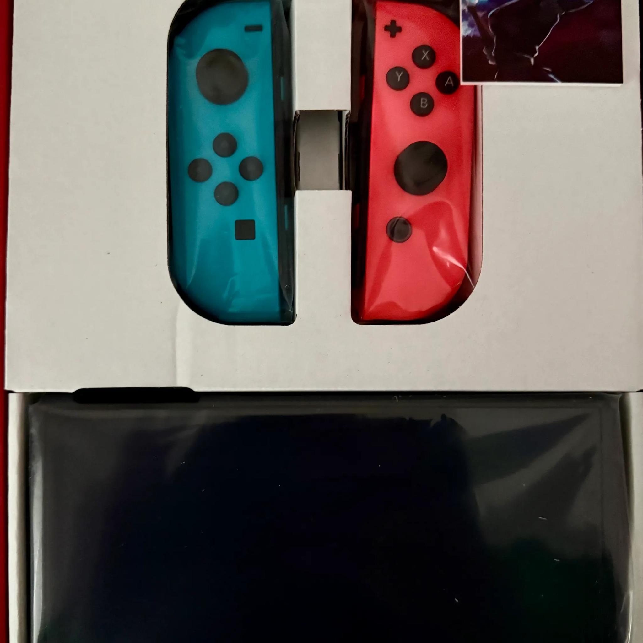 Nintendo Switch – OLED Model w/ Neon Red & Neon Blue Joy-Con