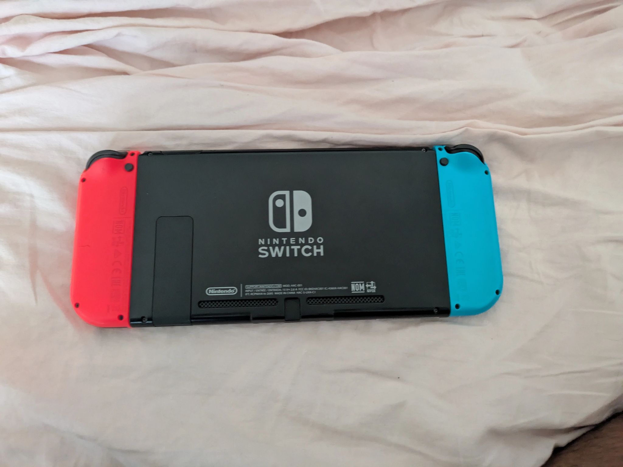 Nintendo Switch with Dock, Charger and controller base with 128GB SD card