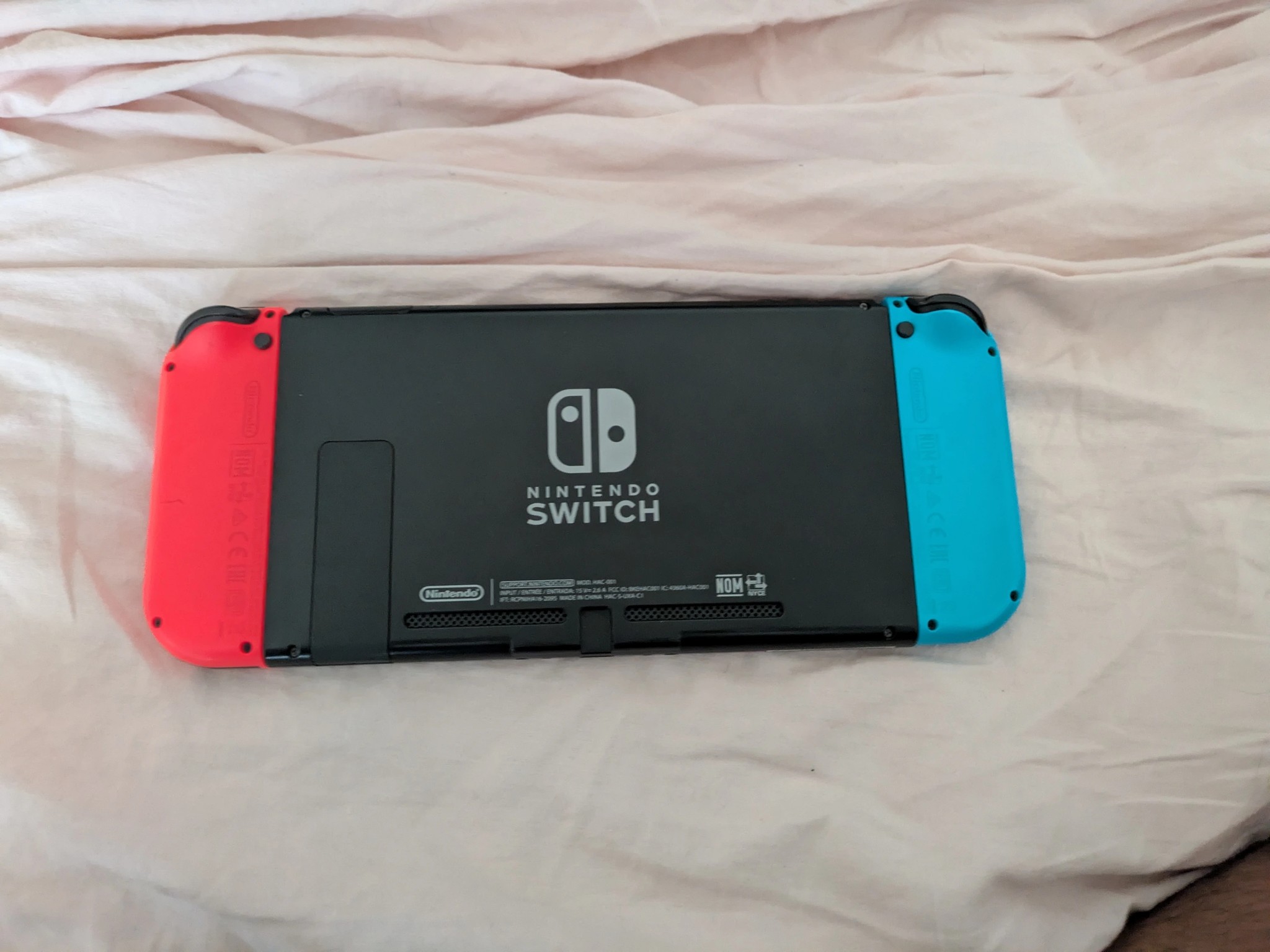 Nintendo Switch with Dock, Charger and controller base with 128GB SD card