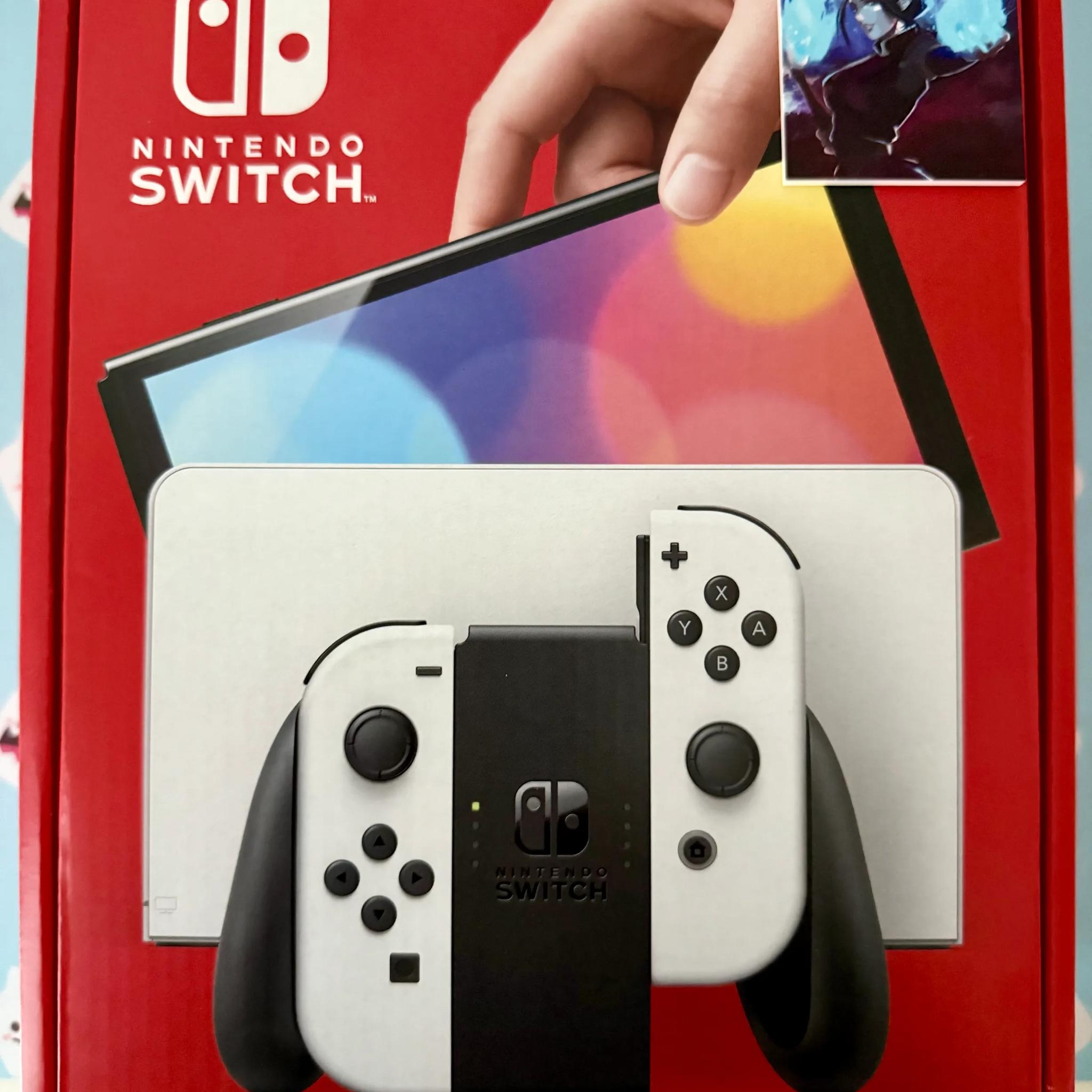 Nintendo Switch – OLED Model w/ White Joy-Con
