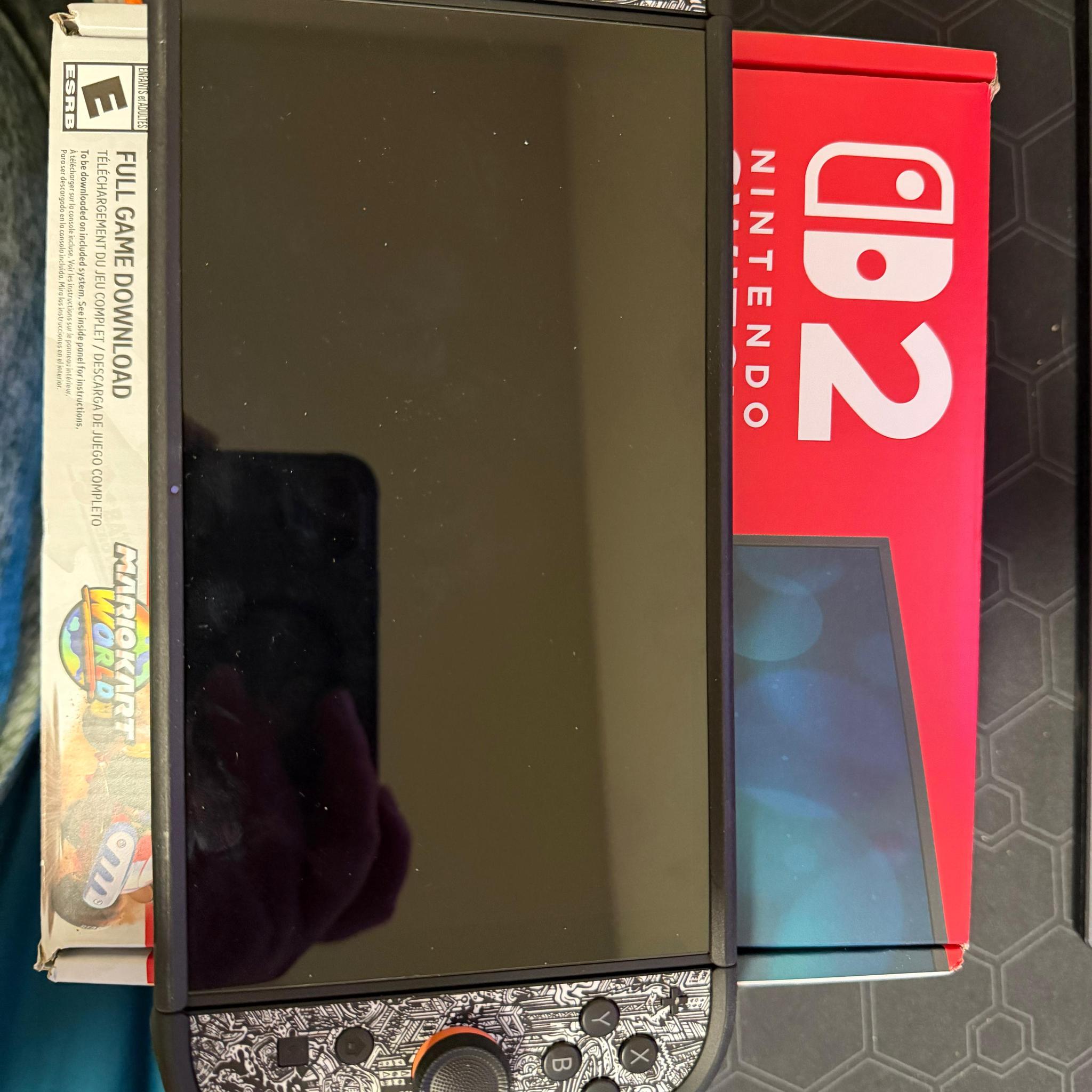 Nintendo switch 2 console with dBrand case and Donkey Kong Bonanza game