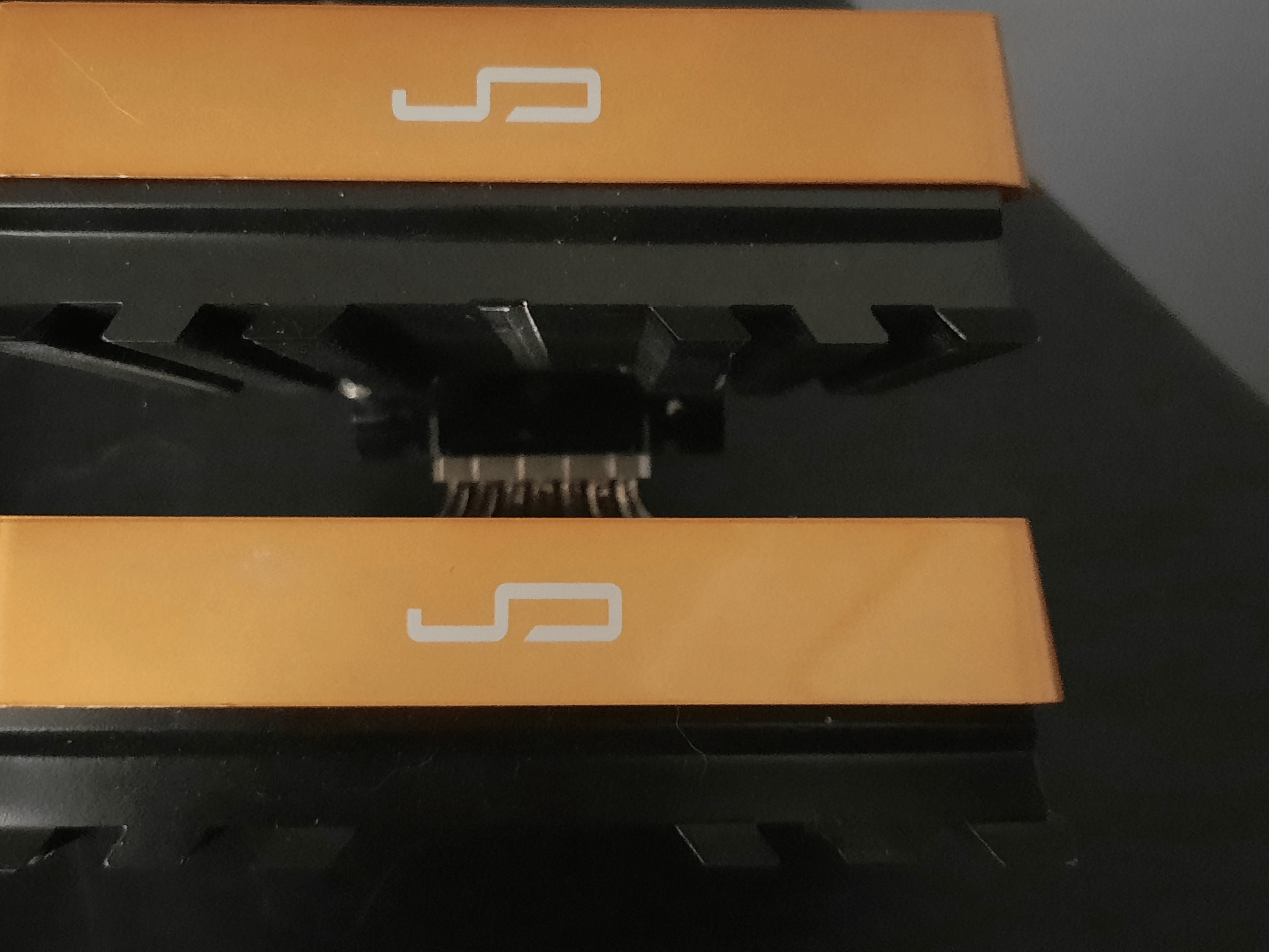 Cryorig R1 CPU cooler with orange and original cover