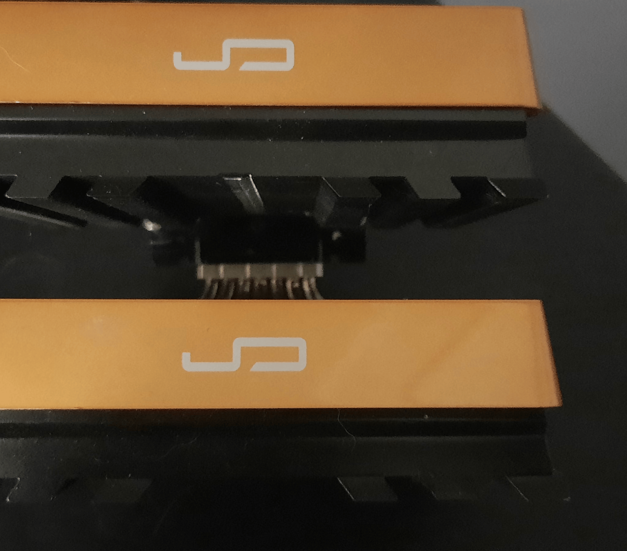 Cryorig R1 CPU cooler with orange and original cover