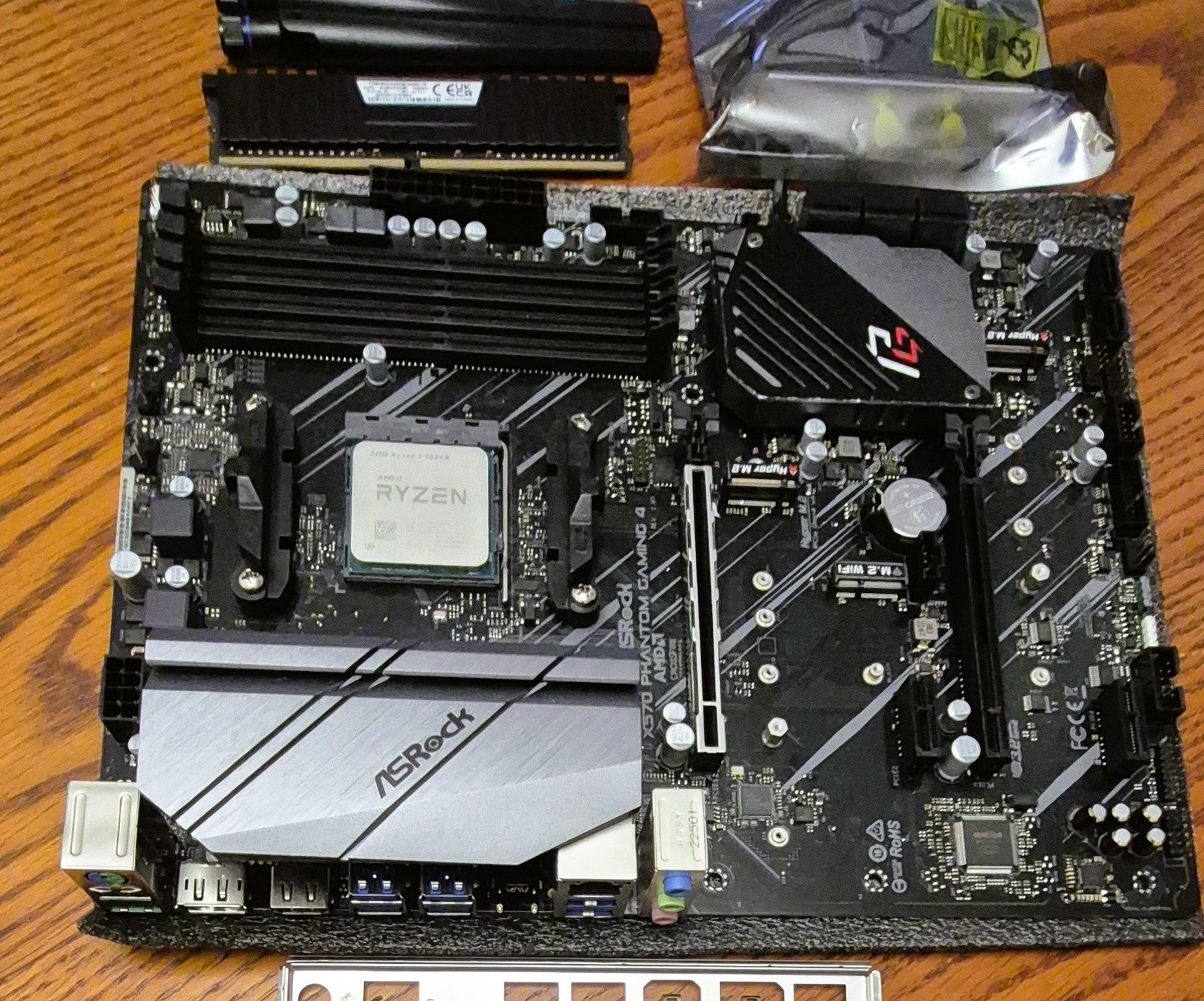 Combo ASRock X570 PHANTOM GAMING 4, AMD Ryzen 5 5600X AM4 CPU, 32GB RAM, AC1200 PCI-E WiFi Card