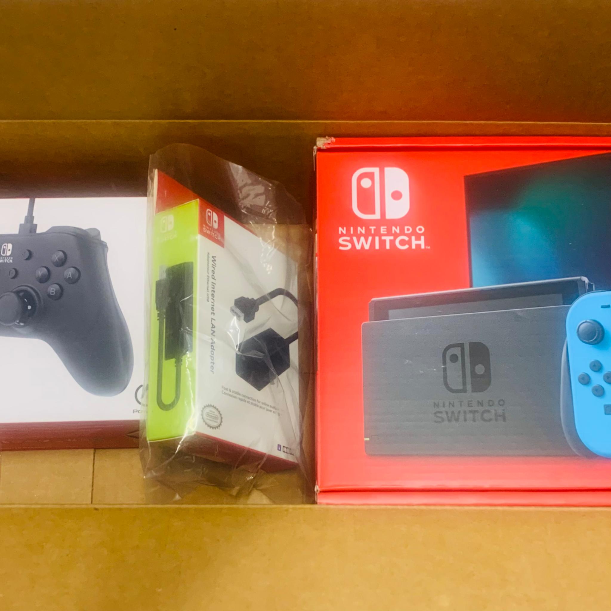 New in box Nintendo switch (v2) + controller + ethernet adapter