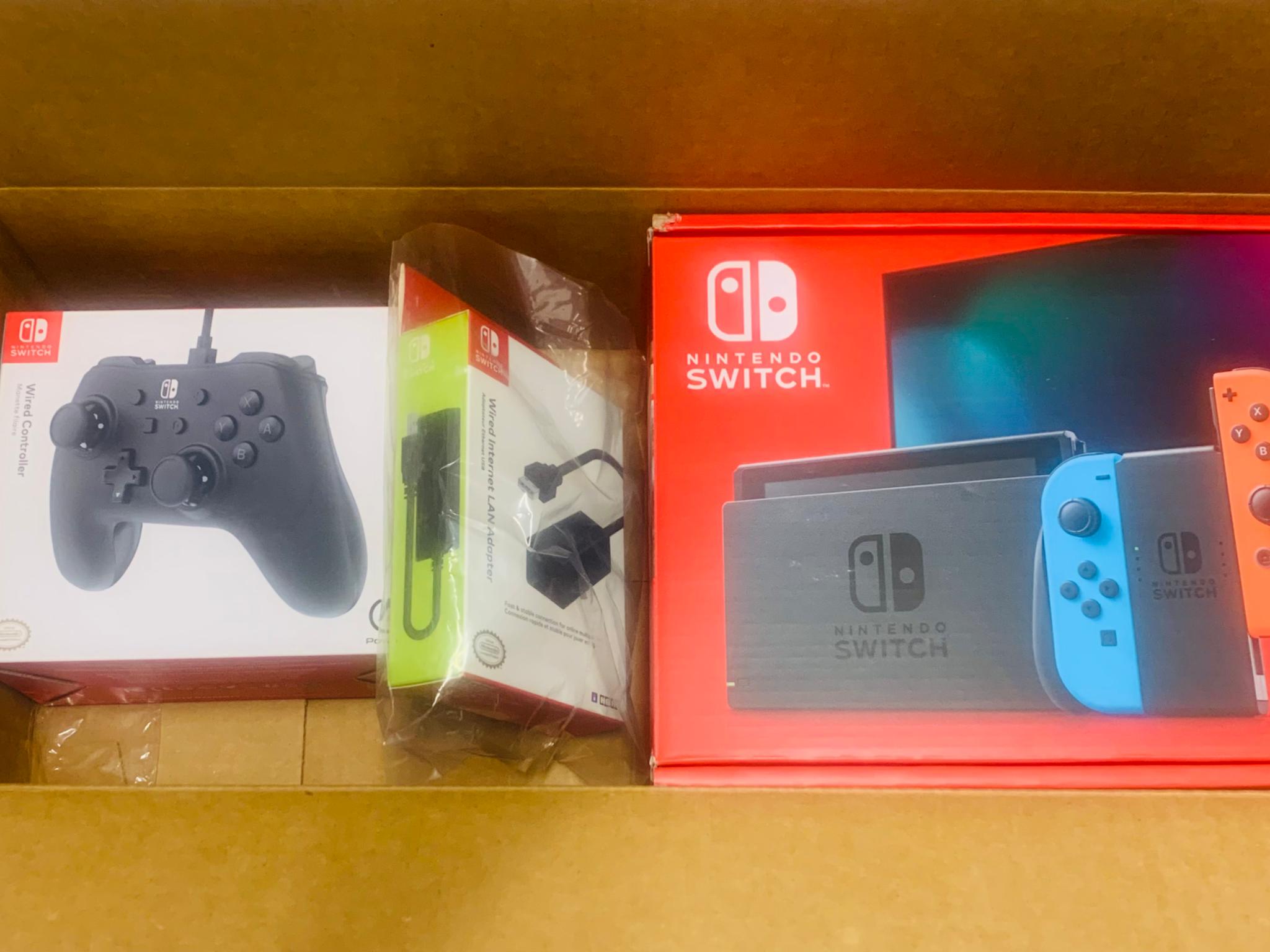 New in box Nintendo switch (v2) + controller + ethernet adapter