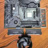 Pre-owned AMD Ryzen 9 5950X CPU, ASUS TUF Gaming X570 Plus (WI-FI) AXT M-board  and AMD Wrath Cooler