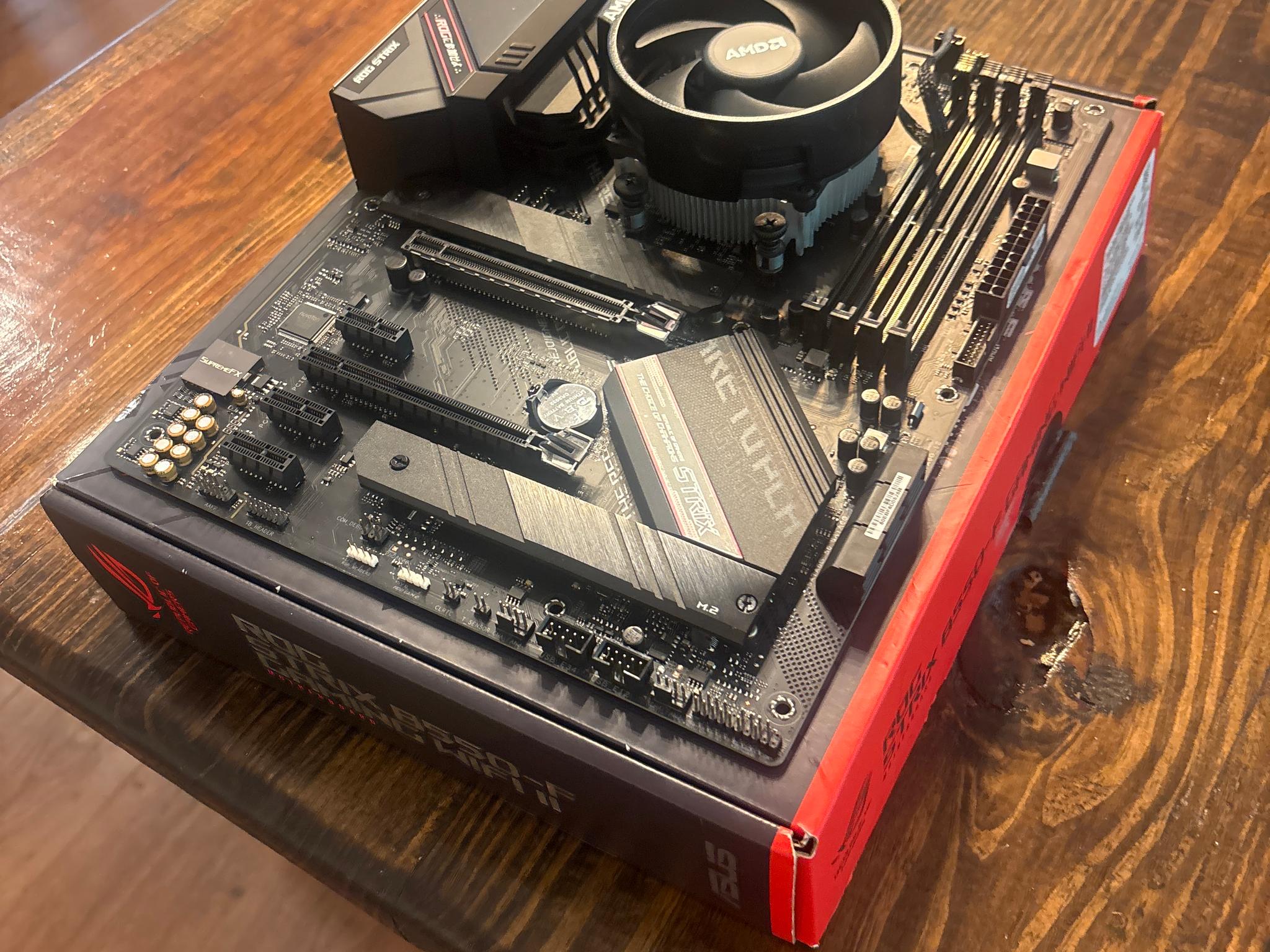 Used but good condition Rog motherboard and Ryzen 5 5500 CPU with stock AMD cooler