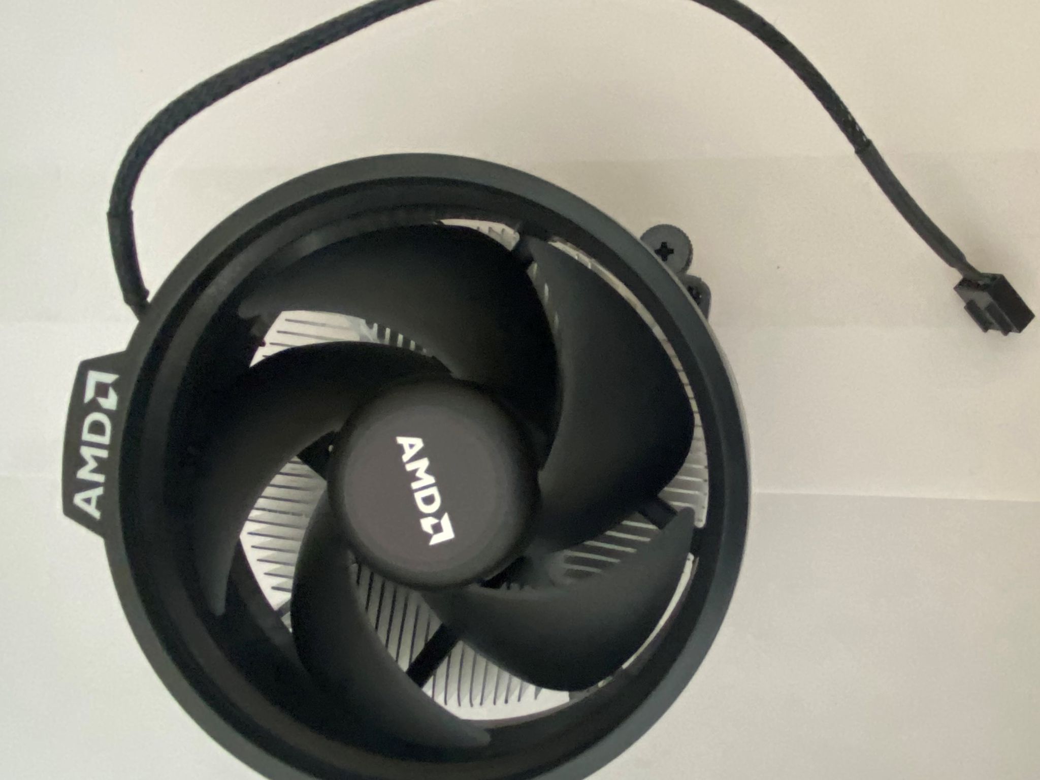 AMD Ryzen 5 3600XT 3.8 GHz 6-Core Processor and AMD Cooler in box.