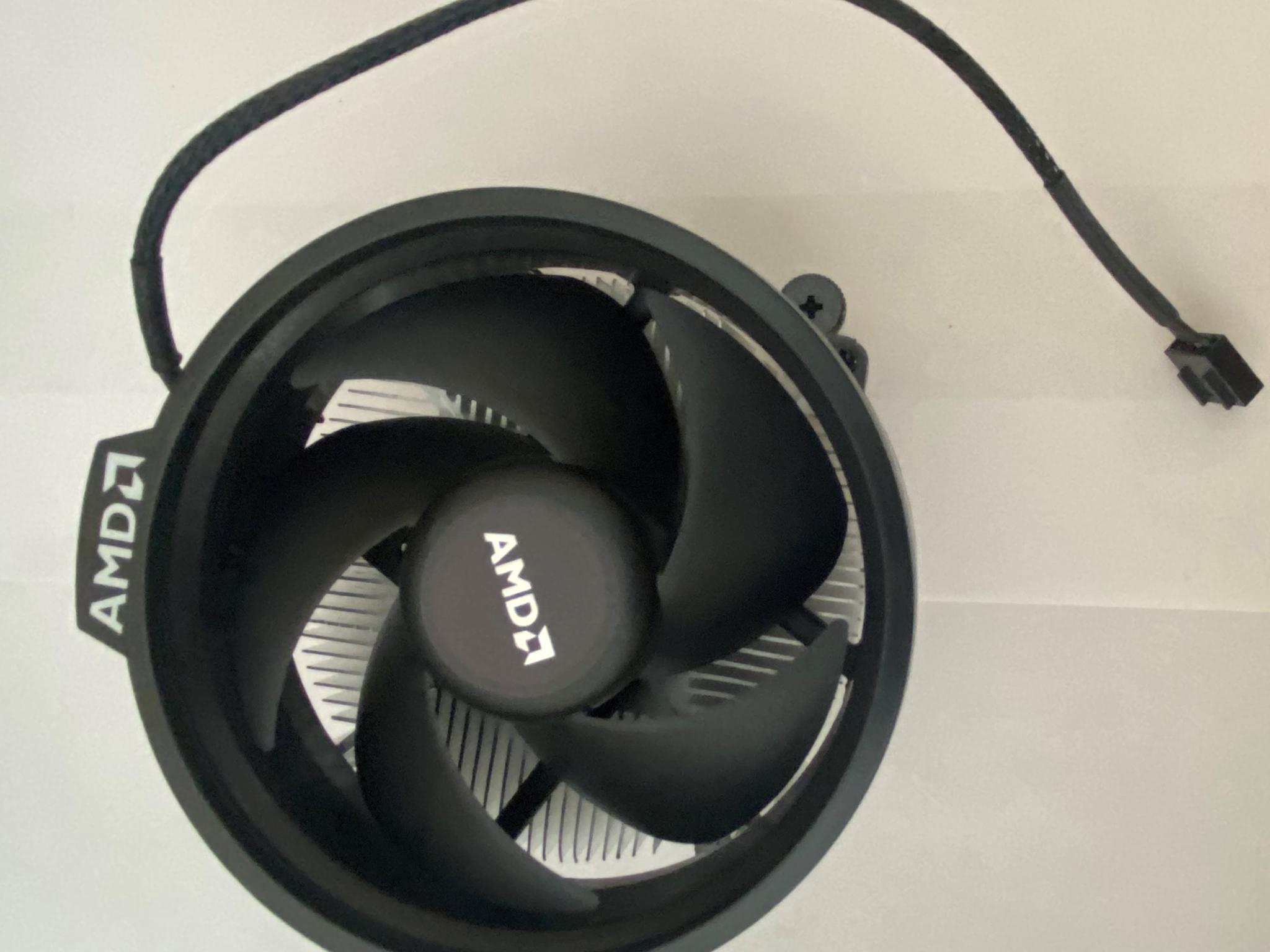 AMD Ryzen 5 3600XT 3.8 GHz 6-Core Processor and AMD Cooler in box.