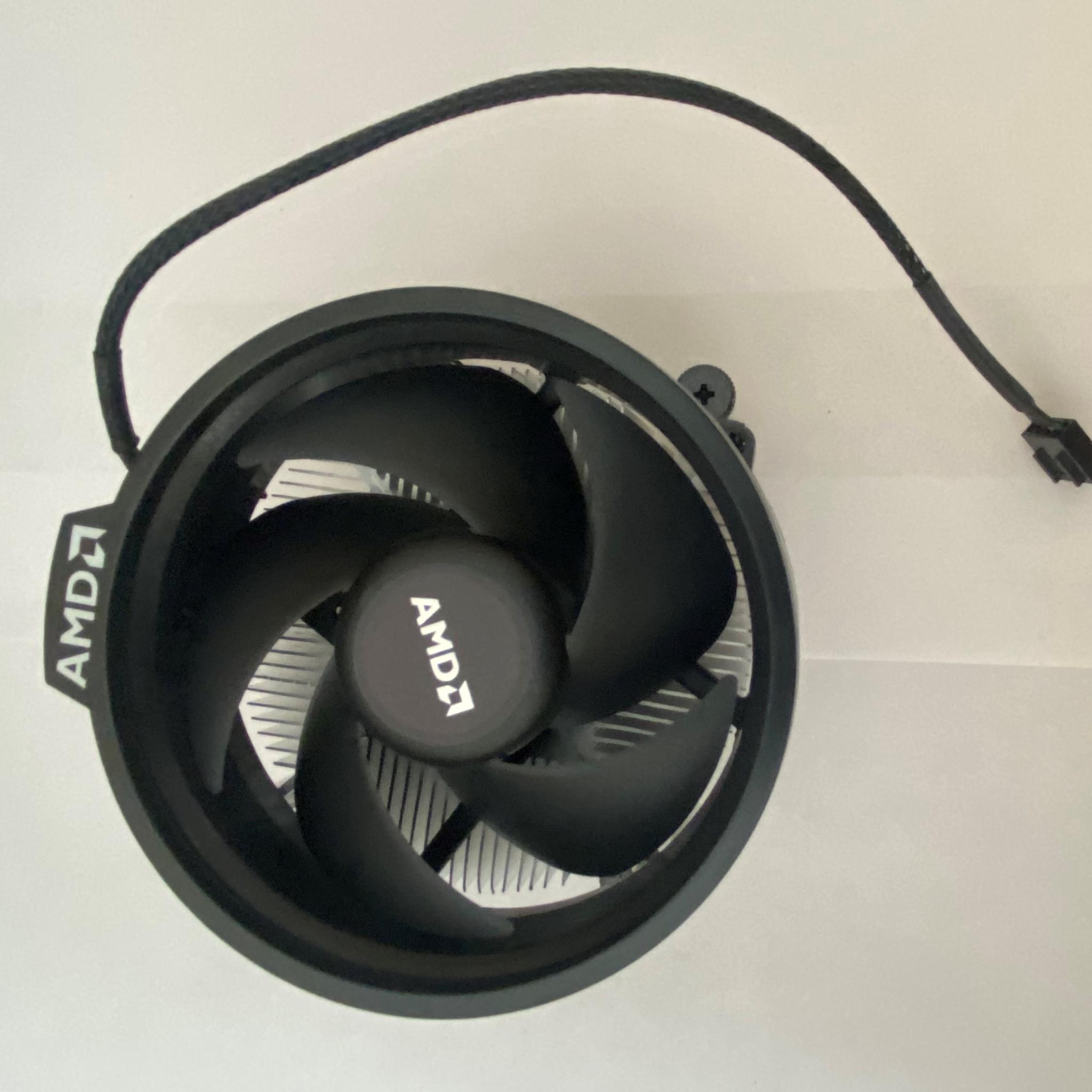 AMD Ryzen 5 3600XT 3.8 GHz 6-Core Processor and AMD Cooler in box.