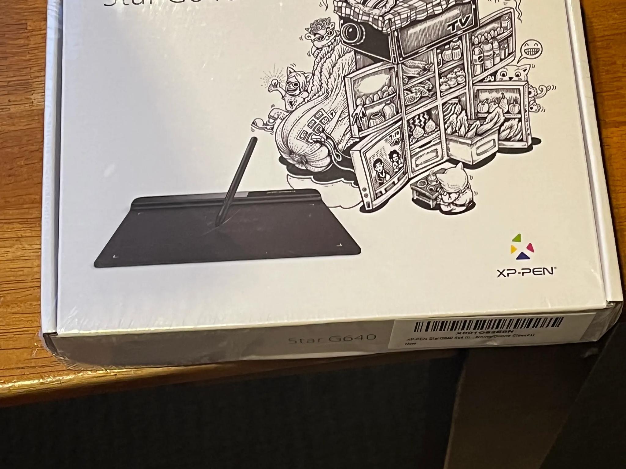 drawing pen/ tablet? Idk much about it, box has some dents but factory seal.