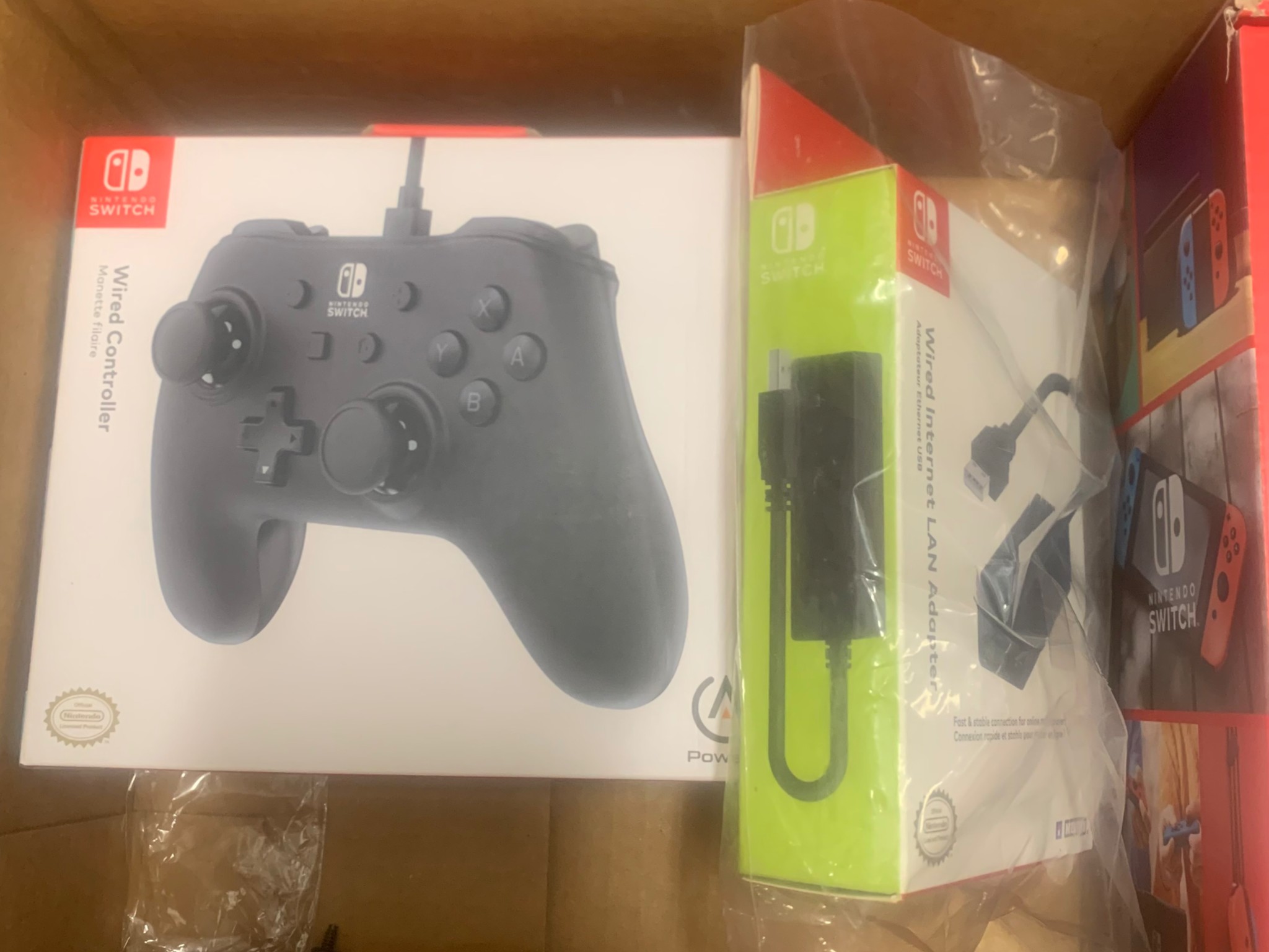 New in box Nintendo switch (v2) + controller + ethernet adapter