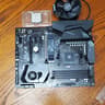 COMBO Pre-owned Gigabyte X570 Gaming MoB Plus AMD Ryzen 9 5950X CPU & AMD CPU Fan & Heatsink Bundle