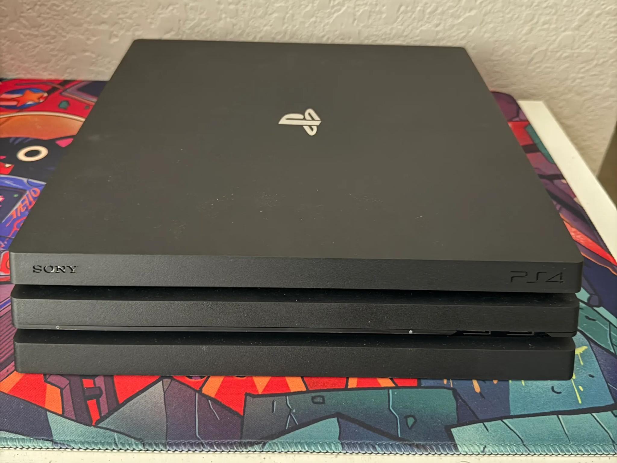 Sony PlayStation 4 Pro 1TB Console (Black) + 7 Games