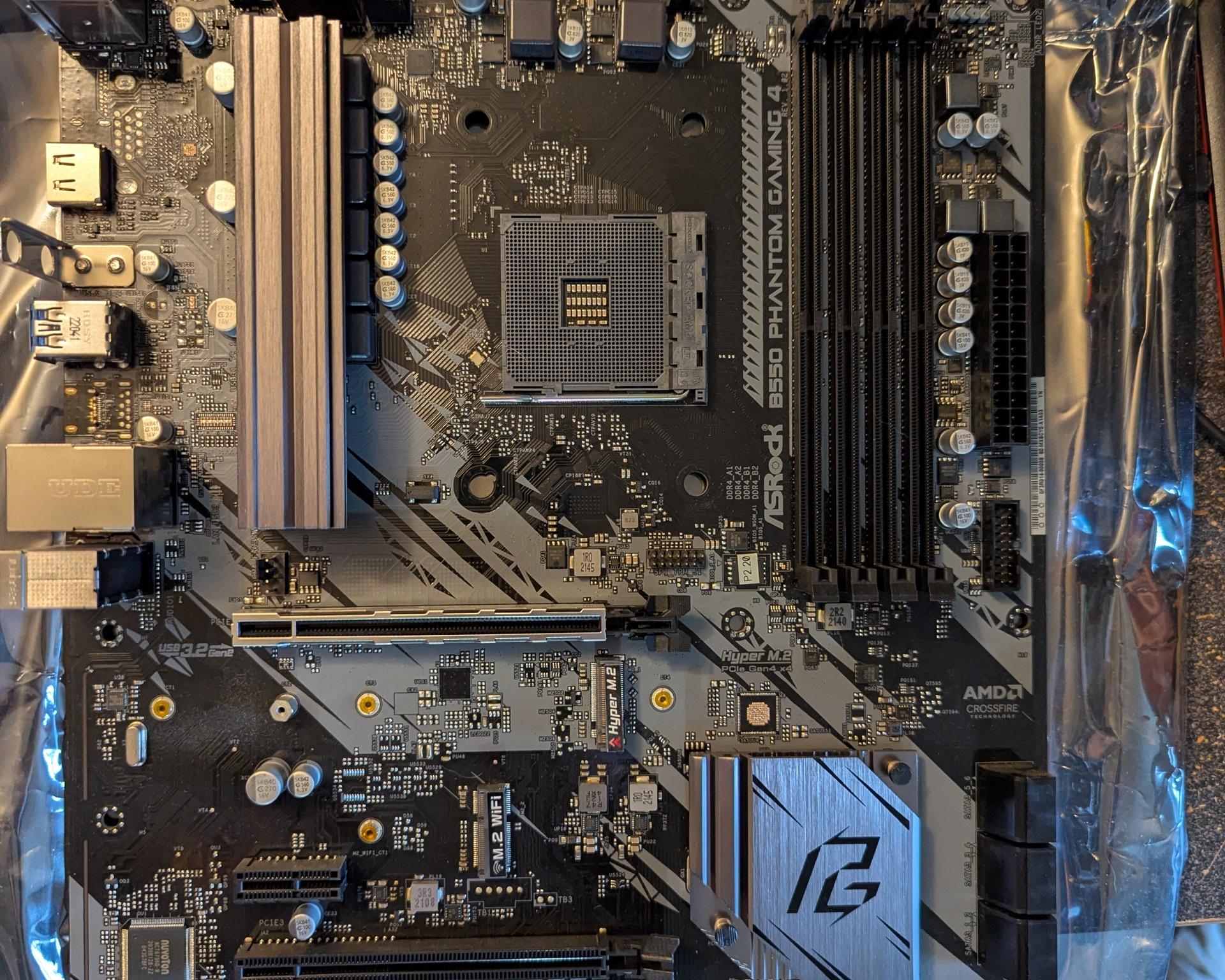 Asrock B550 Phantom Gaming 4 Lightly used. Slot for M.2 Wifi card.