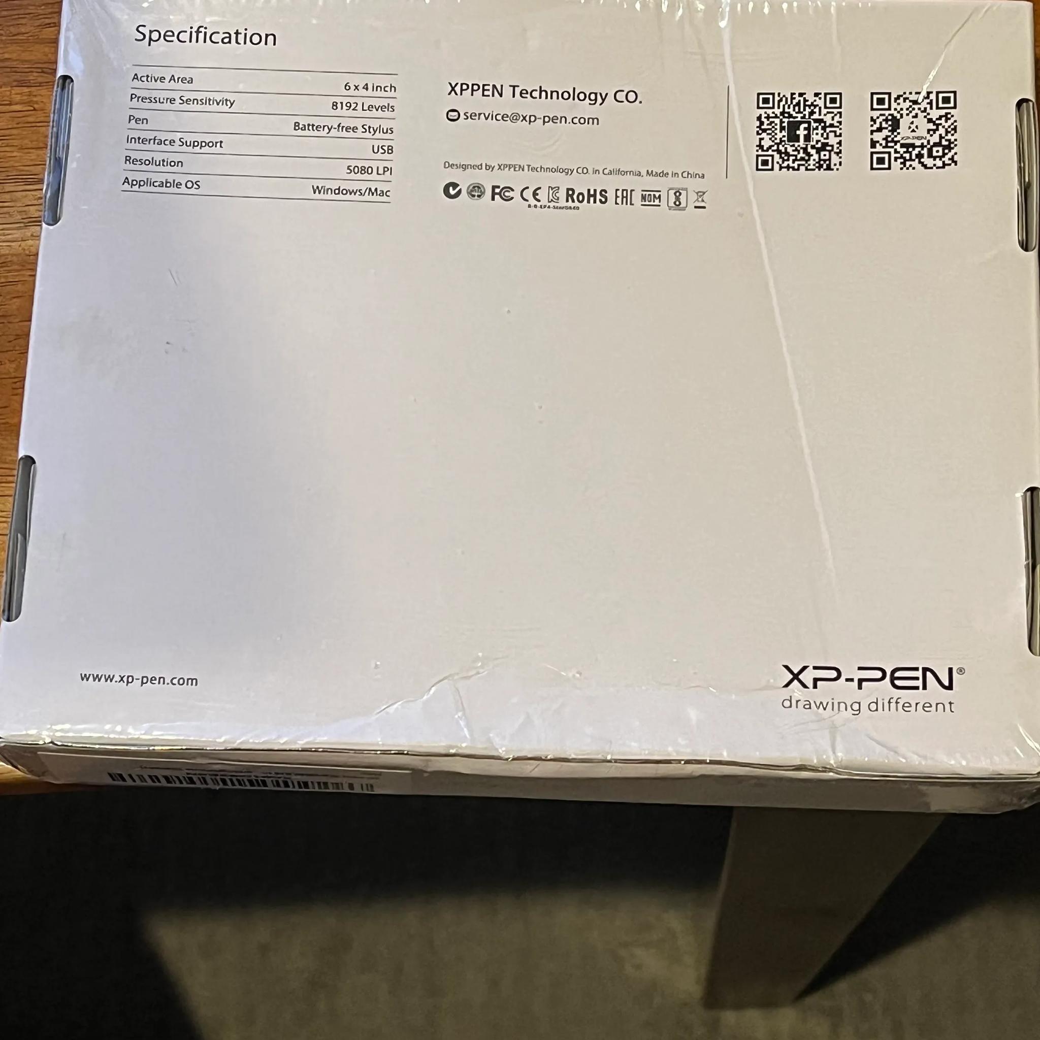 drawing pen/ tablet? Idk much about it, box has some dents but factory seal.