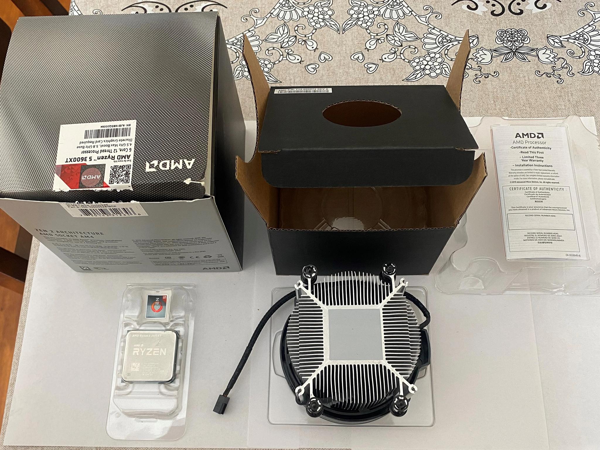 AMD Ryzen 5 3600XT 3.8 GHz 6-Core Processor and AMD Cooler in box.