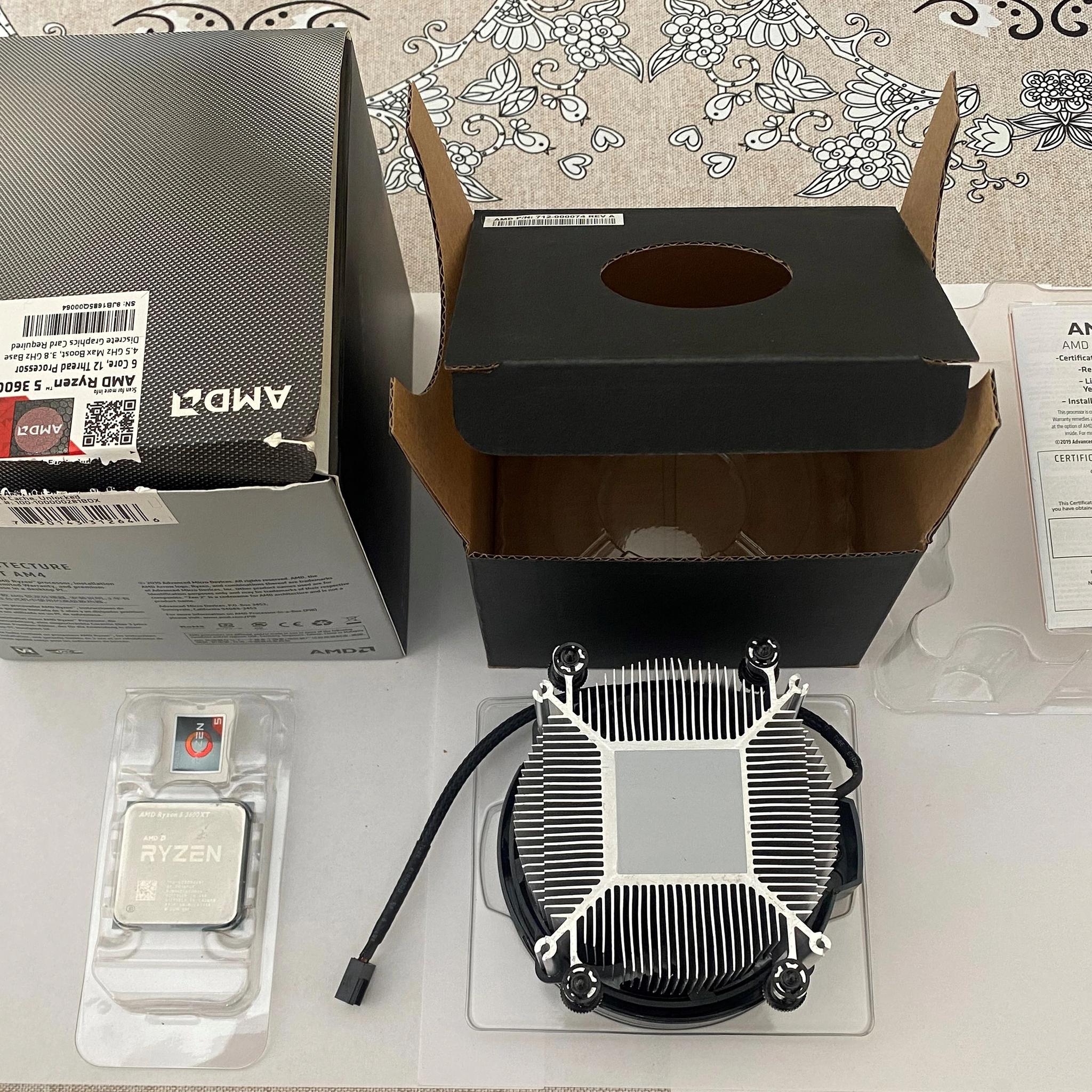 AMD Ryzen 5 3600XT 3.8 GHz 6-Core Processor and AMD Cooler in box.