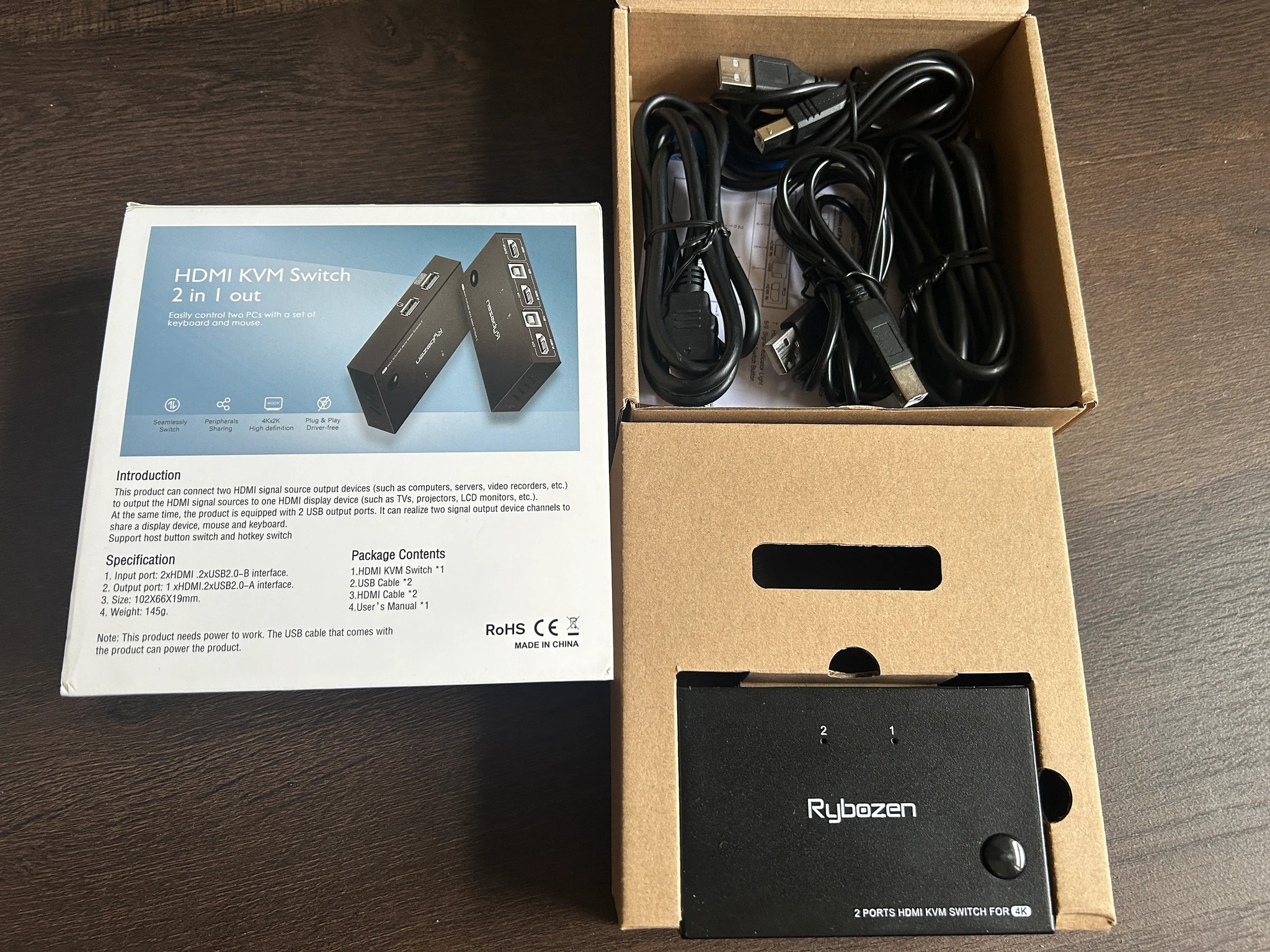 KVM Switch it connects 1 Keyboard, 1 Mouse  and 1 HDMI to 2 computers