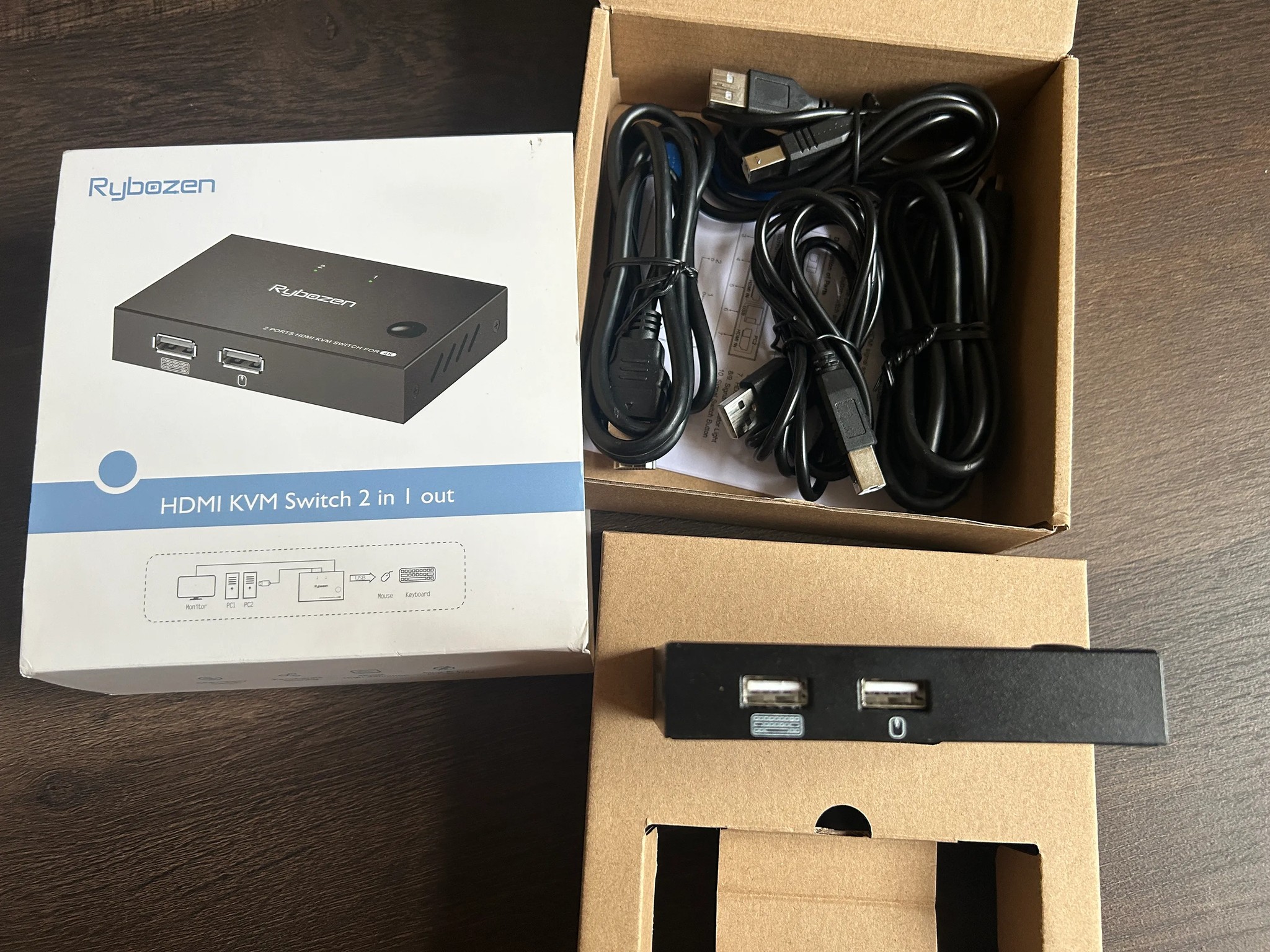 KVM Switch it connects 1 Keyboard, 1 Mouse  and 1 HDMI to 2 computers