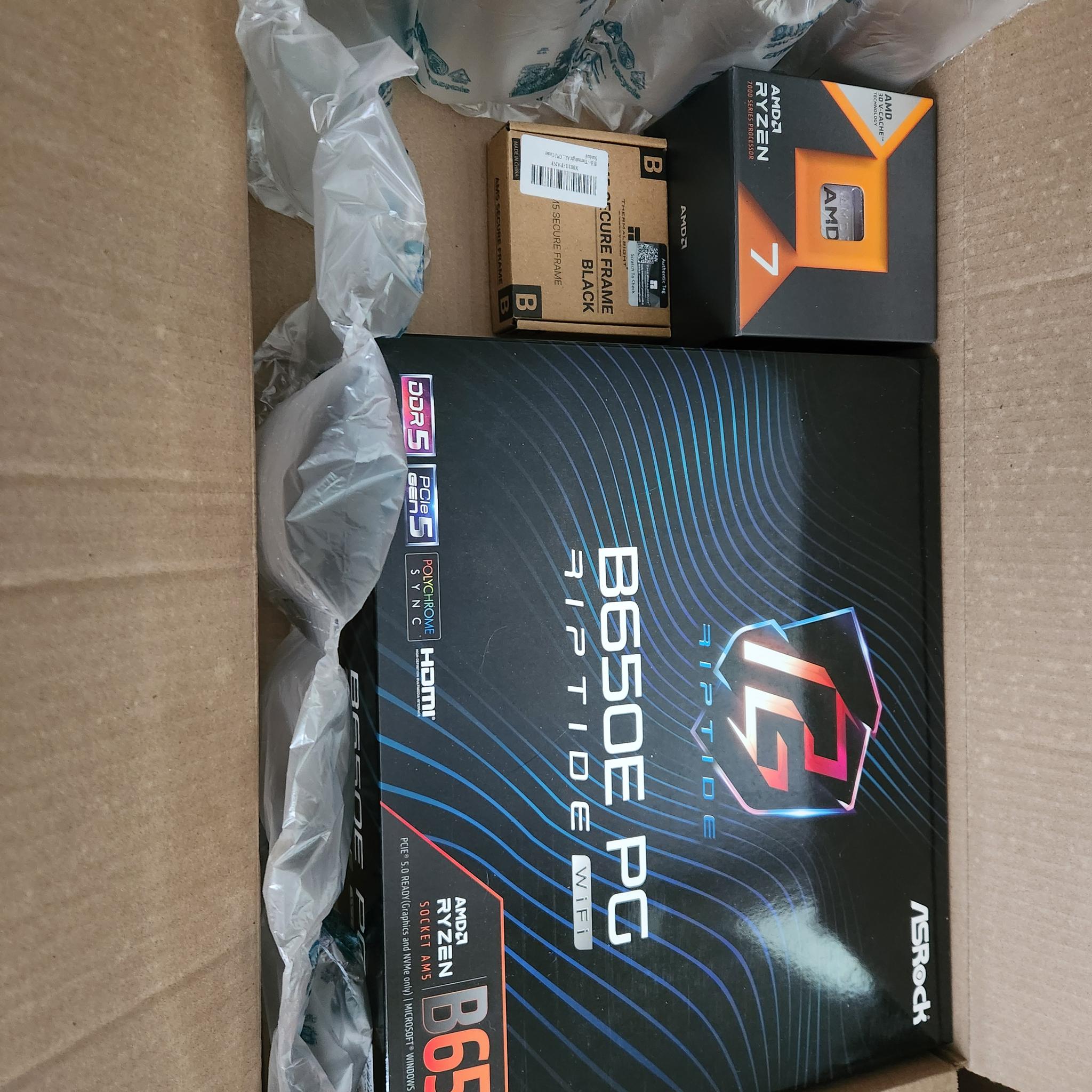 AMD Ryzen 7 7800X3D + ASRock B650E PG Riptide WiFi + Thermaltake Contact Frame Bundle - MINT w/ All