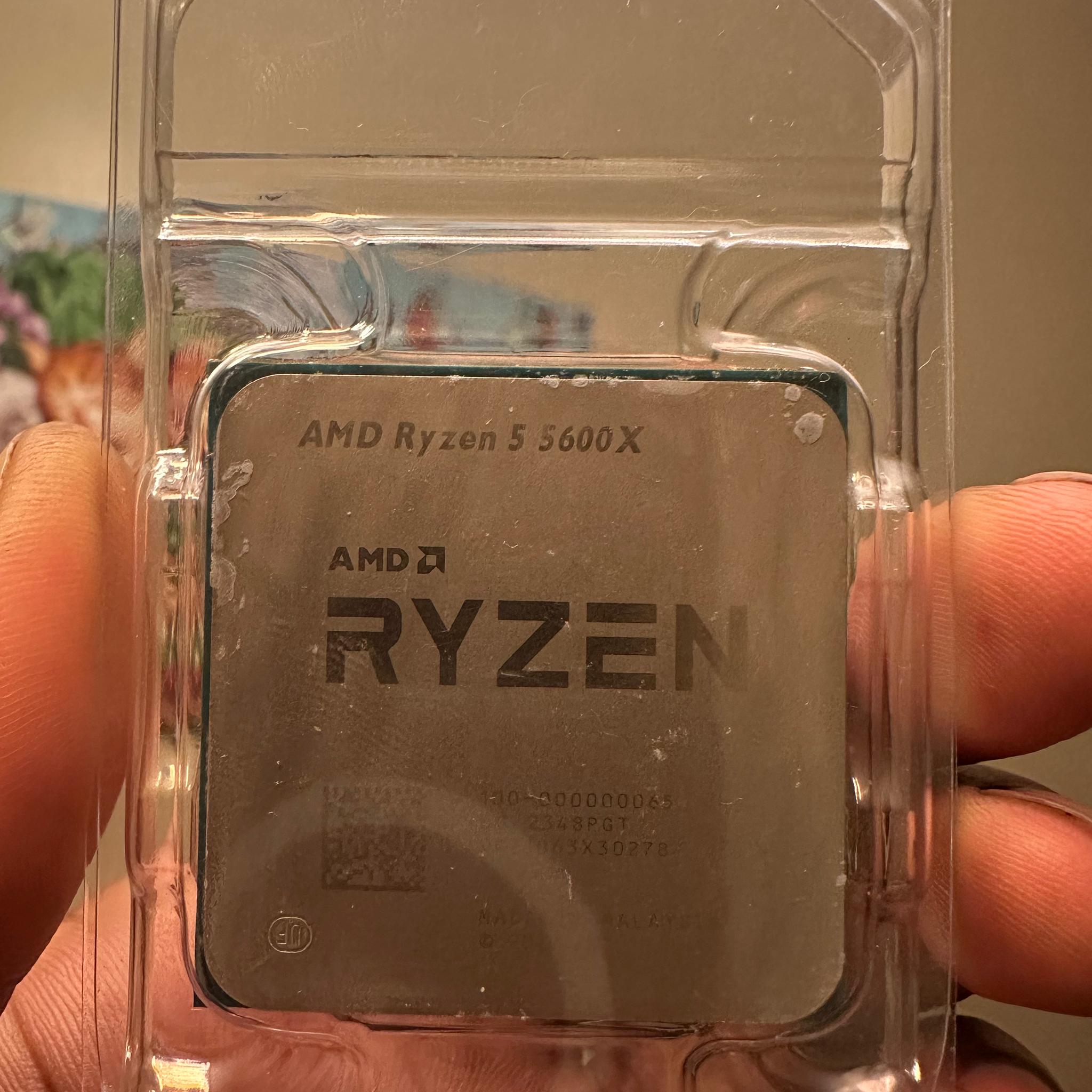 AMD Ryzen5 5600 X and stock cooler with box.