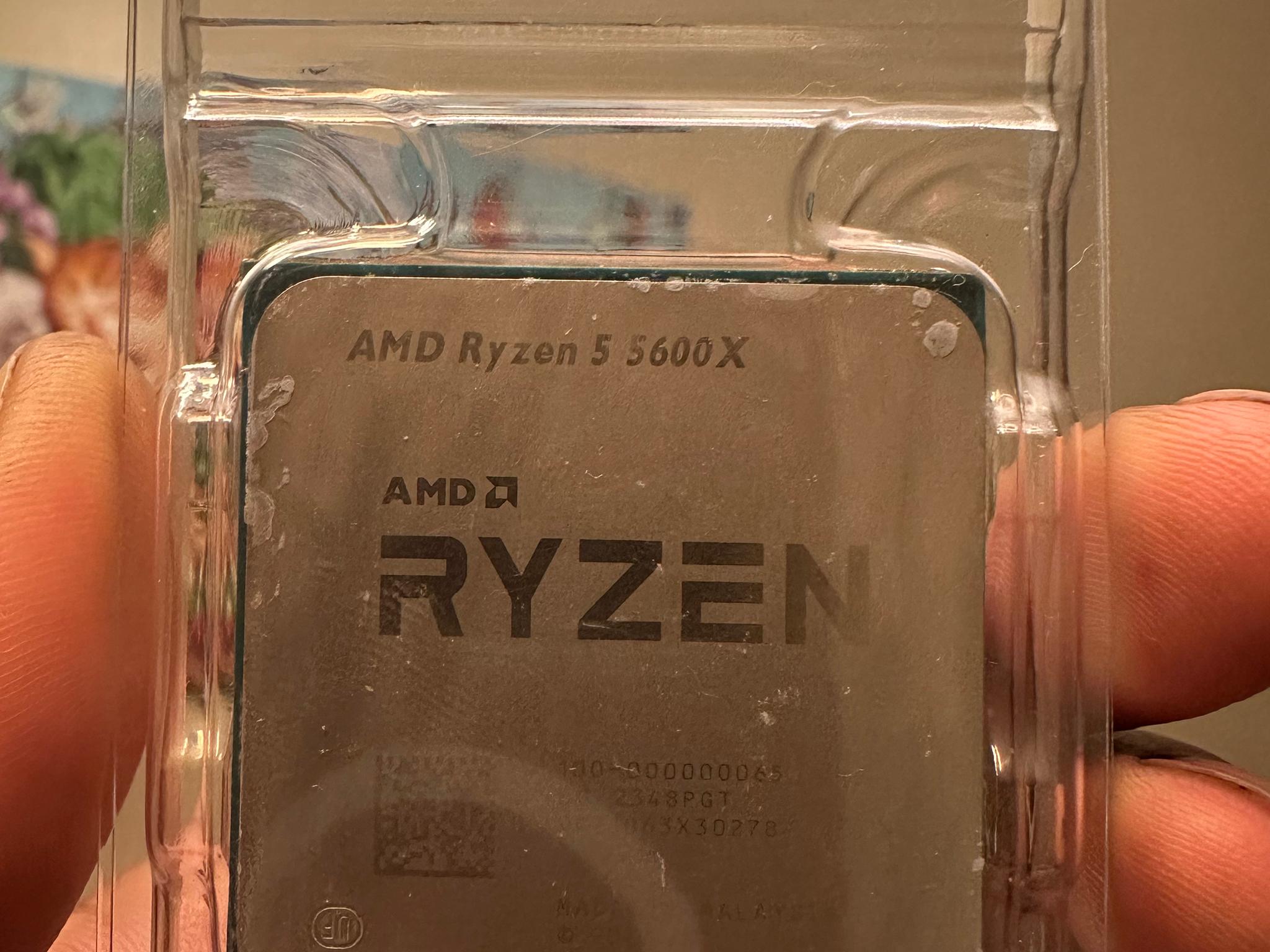 AMD Ryzen5 5600 X and stock cooler with box.