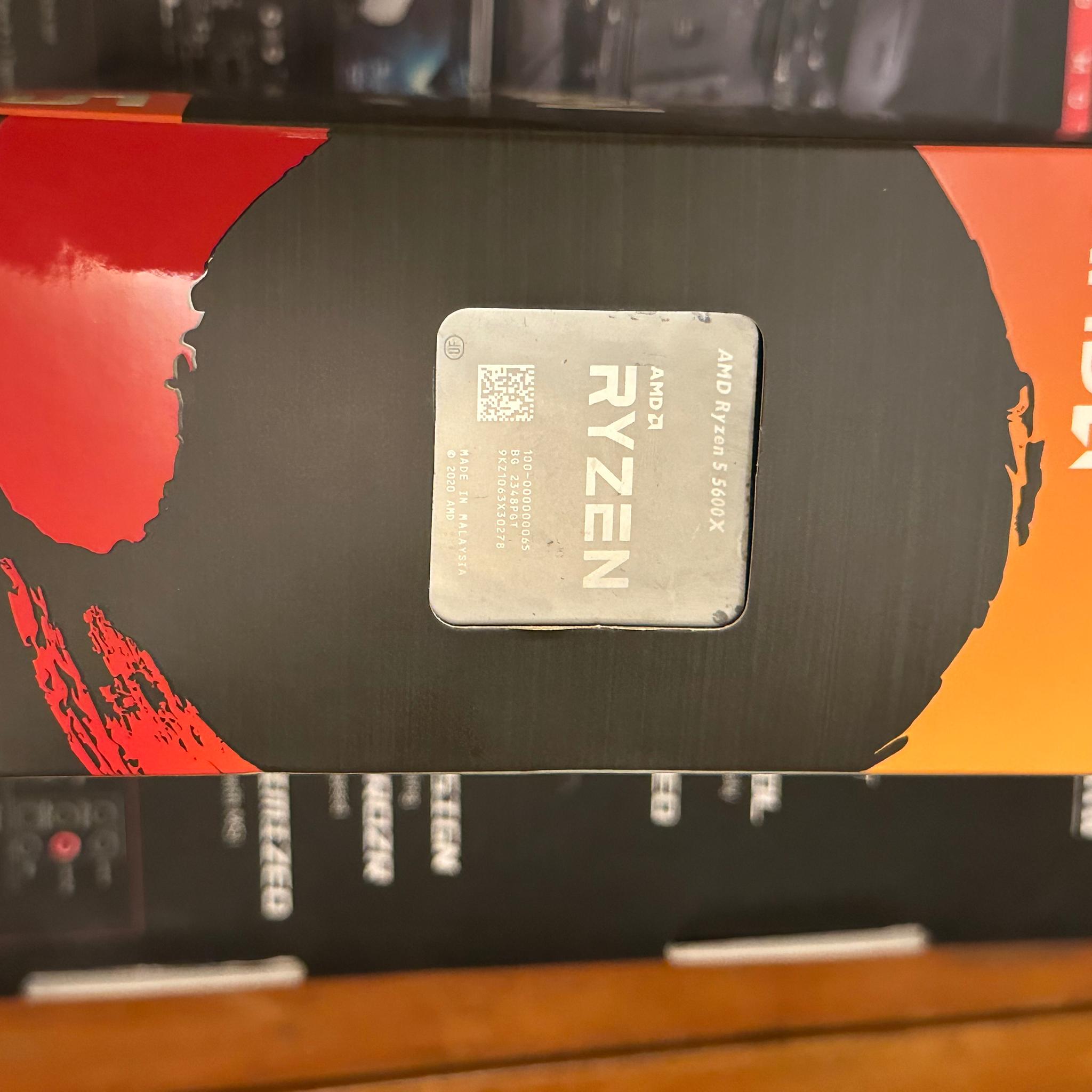 AMD Ryzen5 5600 X and stock cooler with box.