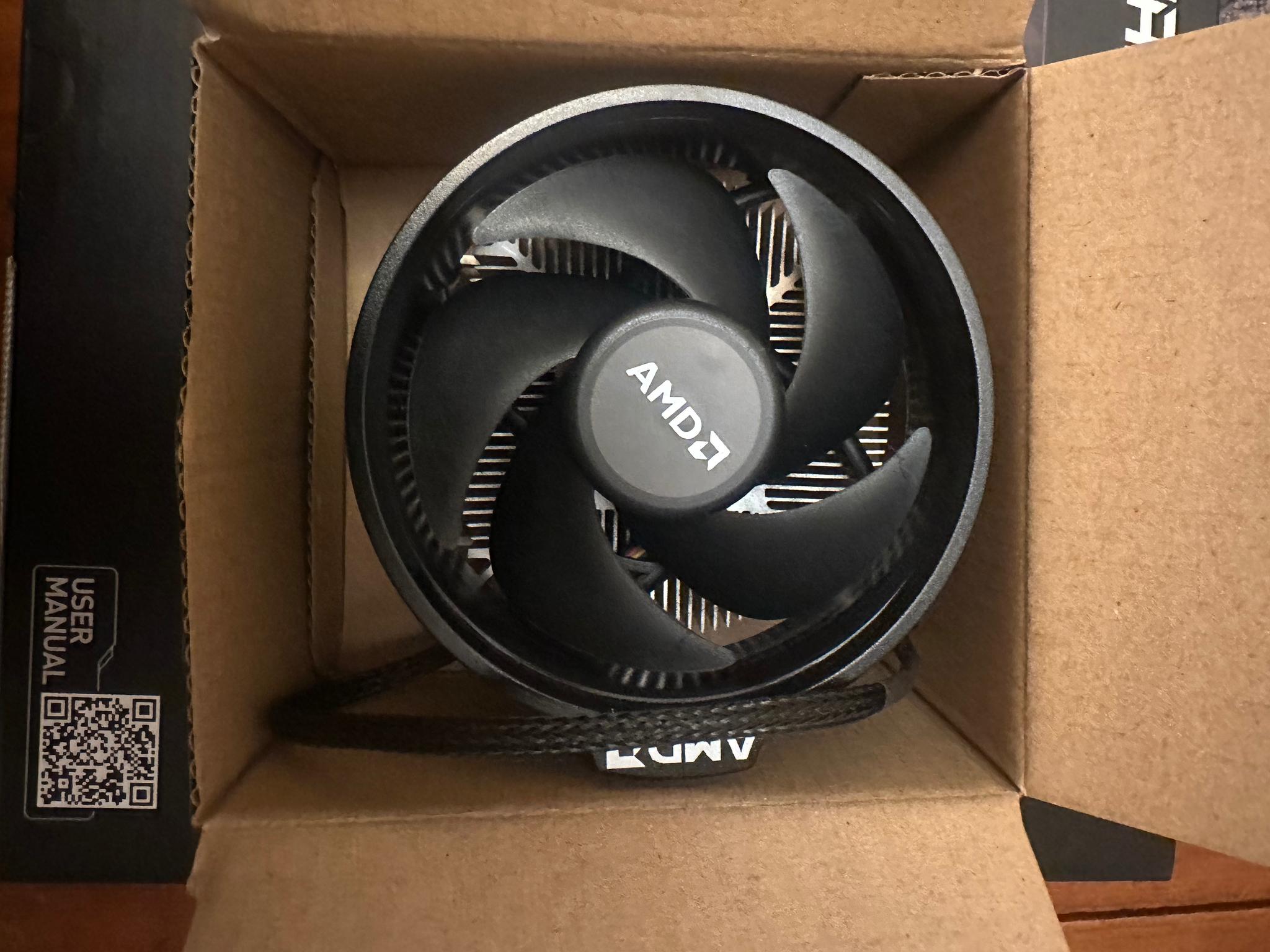 AMD Ryzen5 5600 X and stock cooler with box.