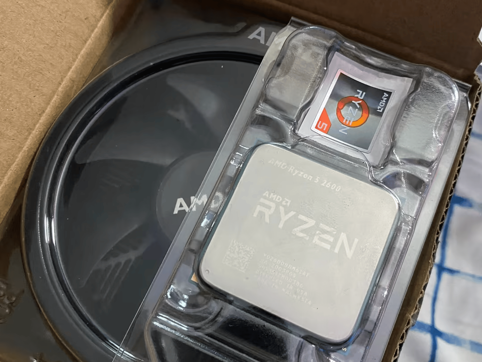 Ryzen 5 2600 (comes with box + cooler) 