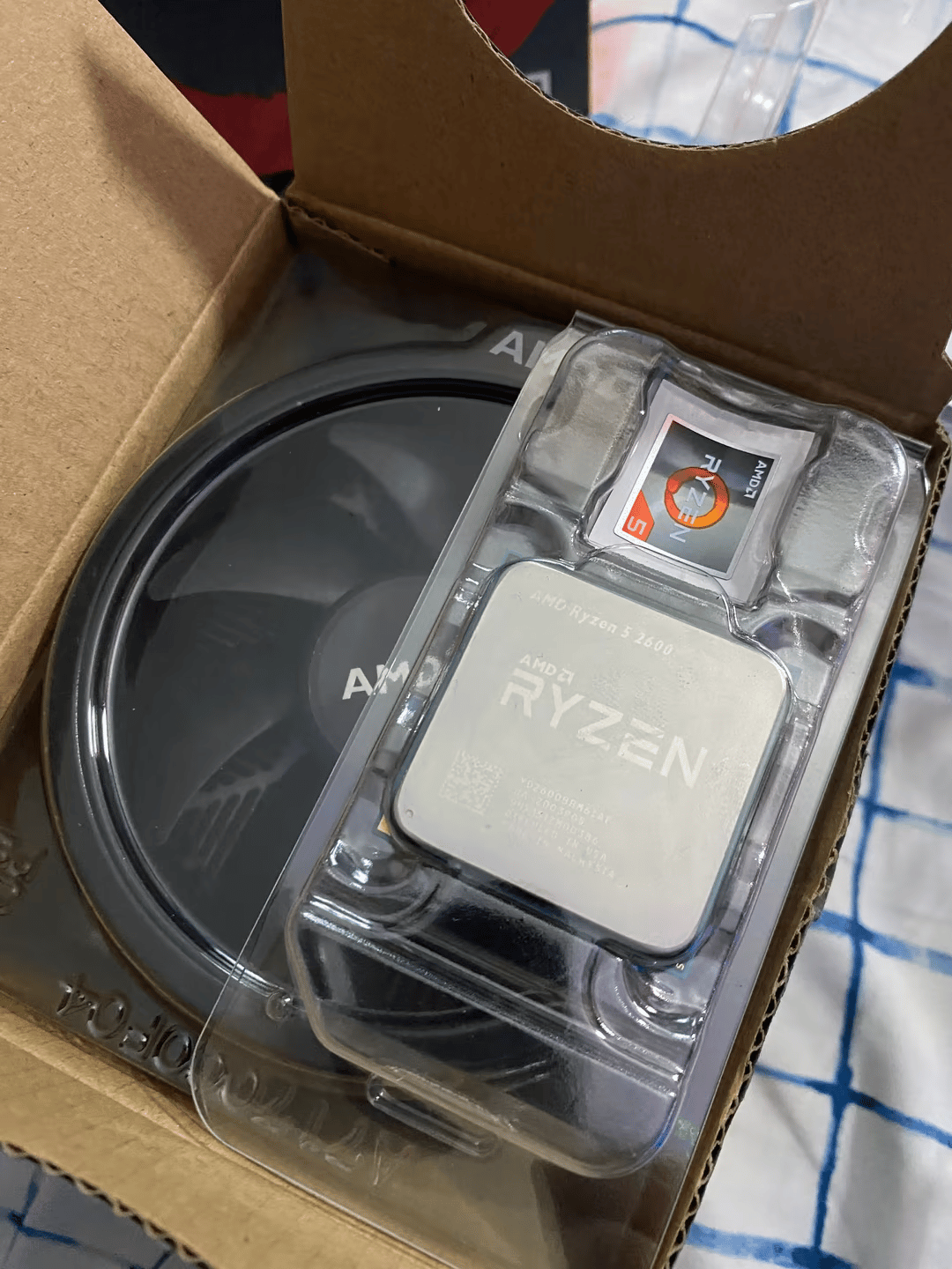 Ryzen 5 2600 (comes with box + cooler) 