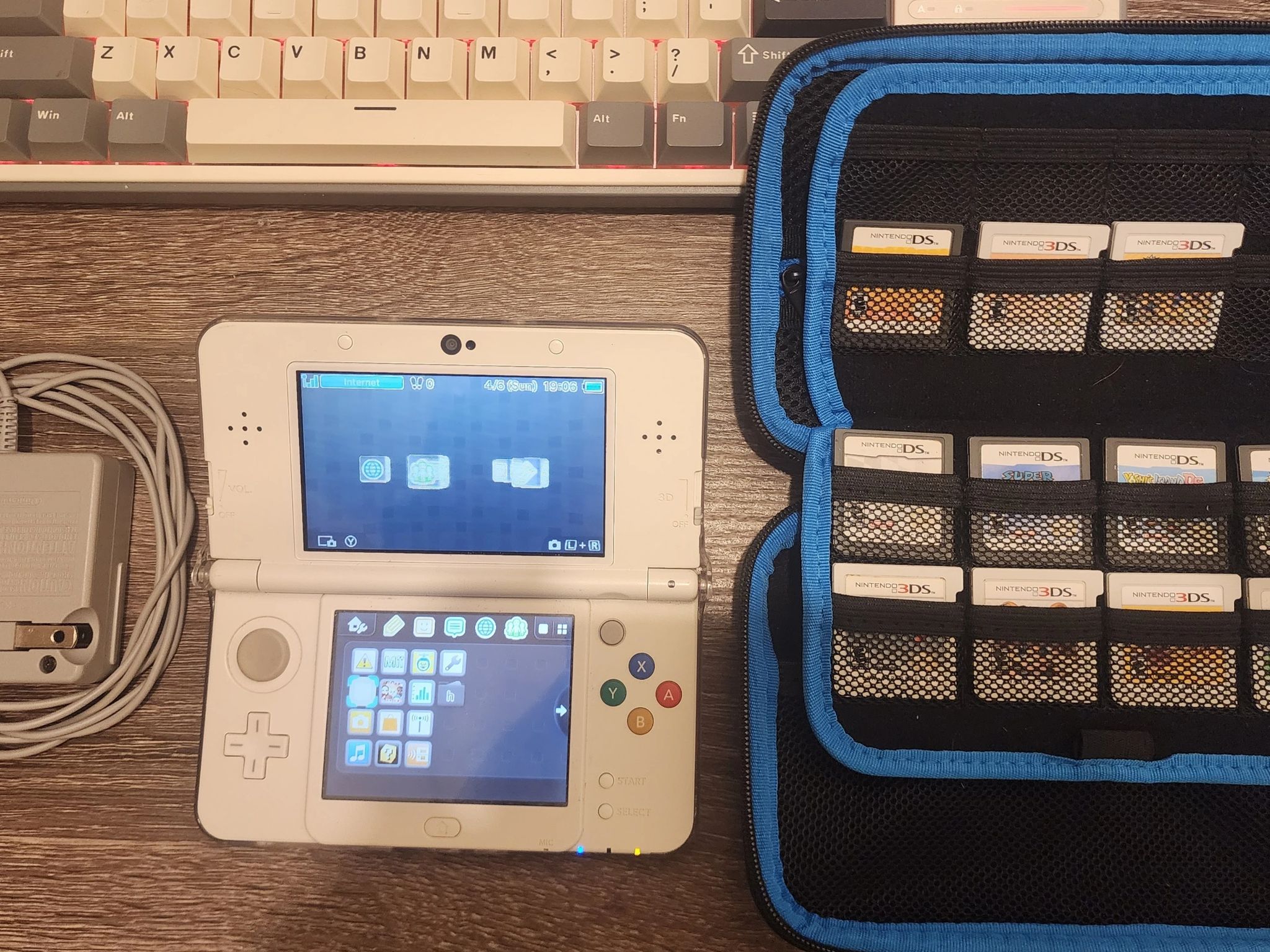 New Nintendo 3DS (Non-XL), Games, Case, 2 chargers, and clear case on console, 32gb microSD