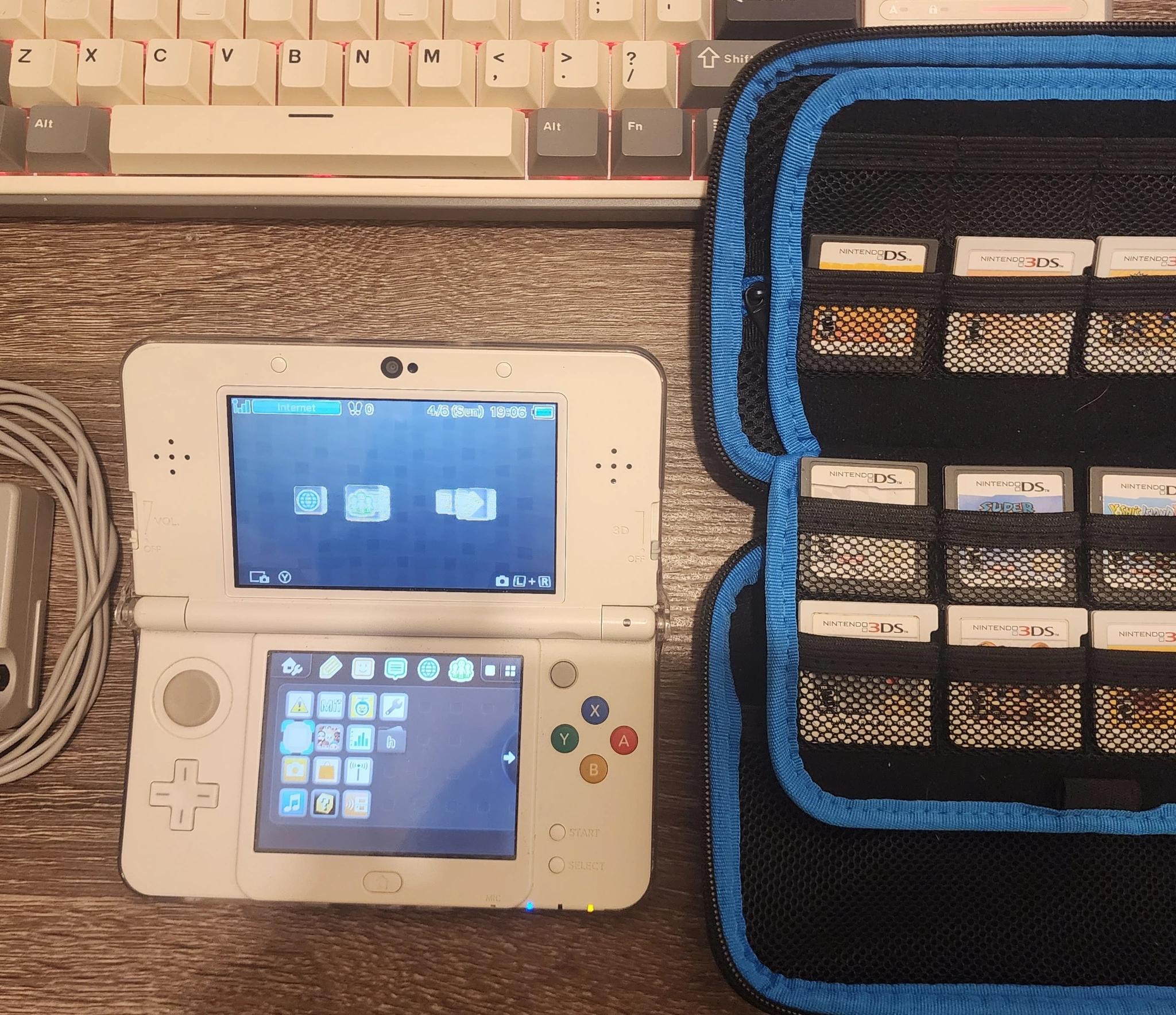 New Nintendo 3DS (Non-XL), Games, Case, 2 chargers, and clear case on console, 32gb microSD