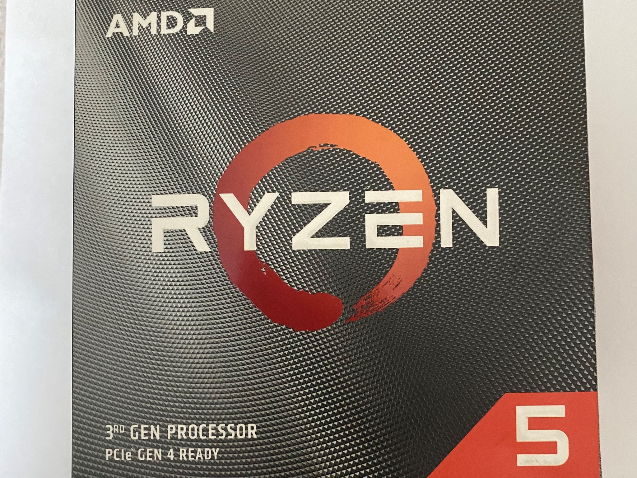 AMD Ryzen 5 3600XT 3.8 GHz 6-Core Processor and AMD Cooler in box.