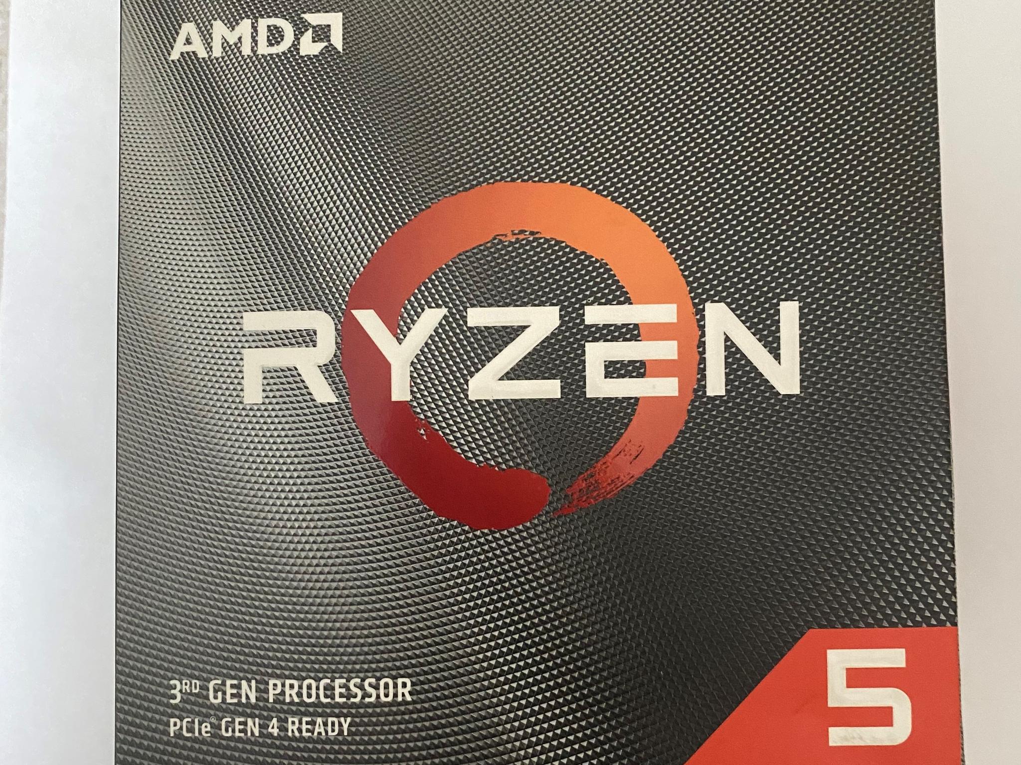 AMD Ryzen 5 3600XT 3.8 GHz 6-Core Processor and AMD Cooler in box.