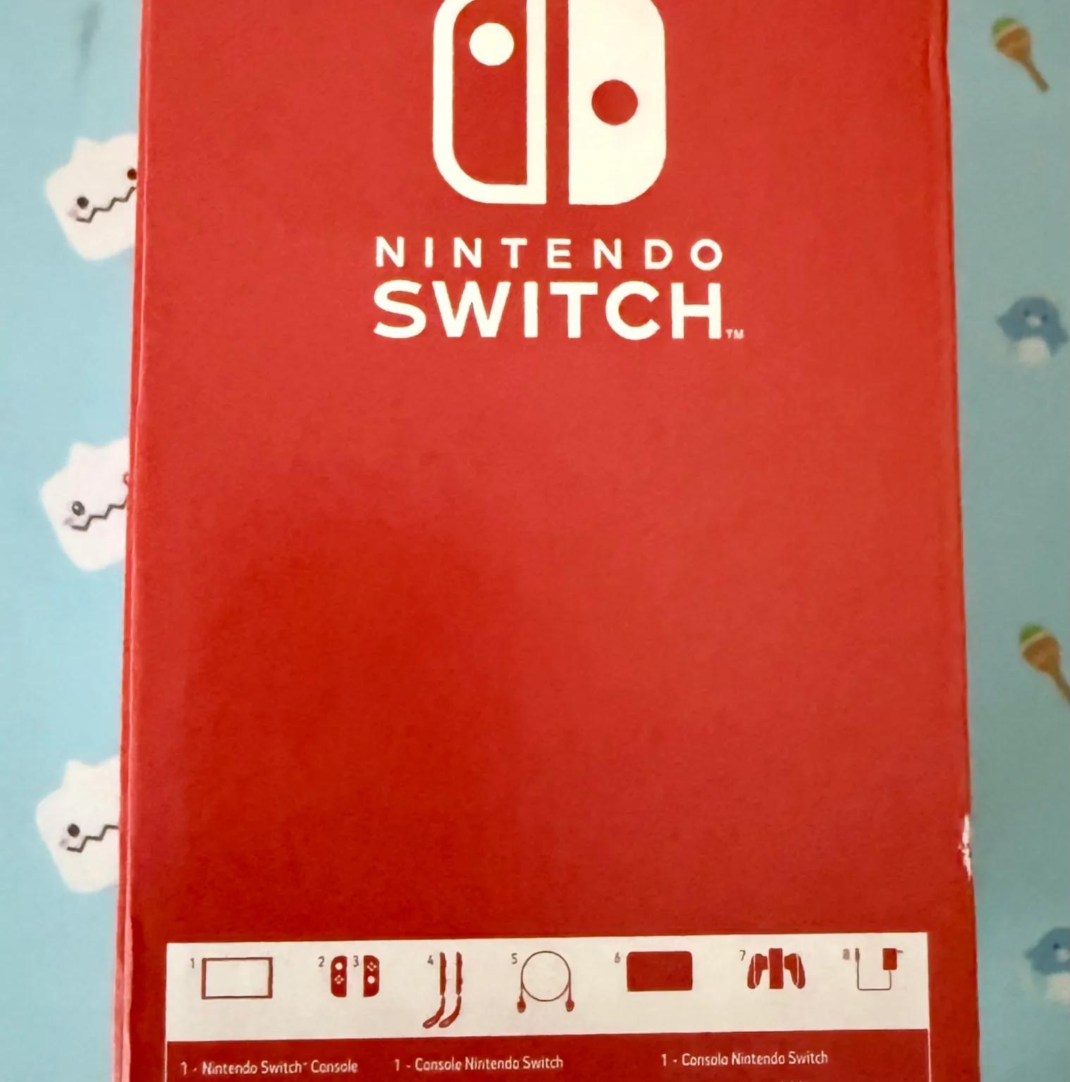 Nintendo Switch – OLED Model w/ White Joy-Con