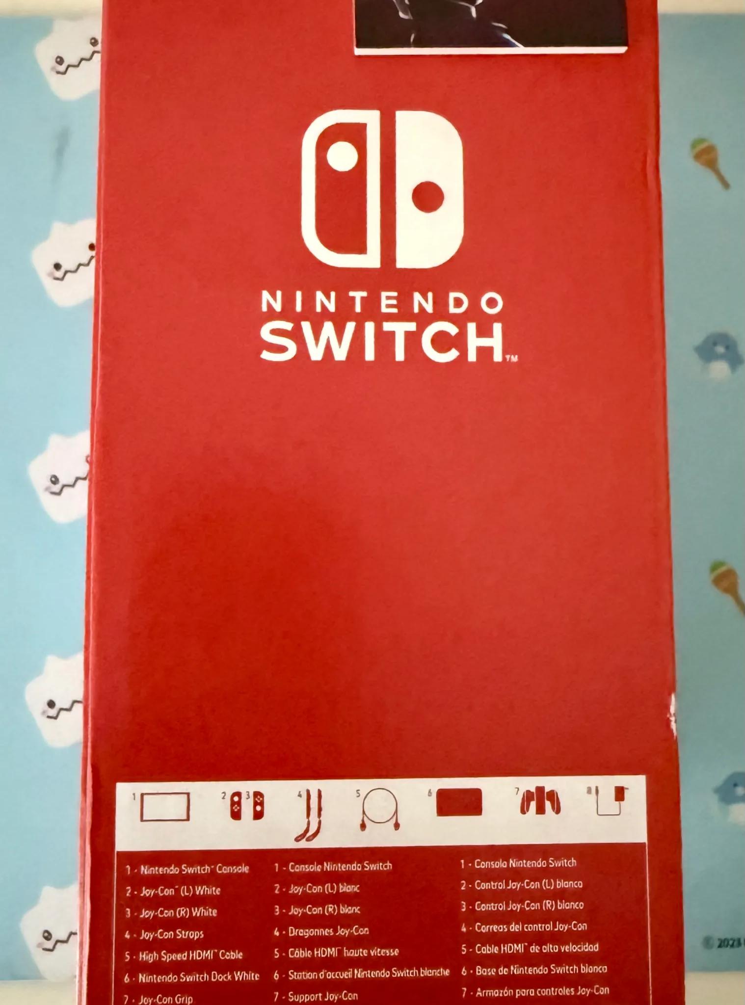Nintendo Switch – OLED Model w/ White Joy-Con