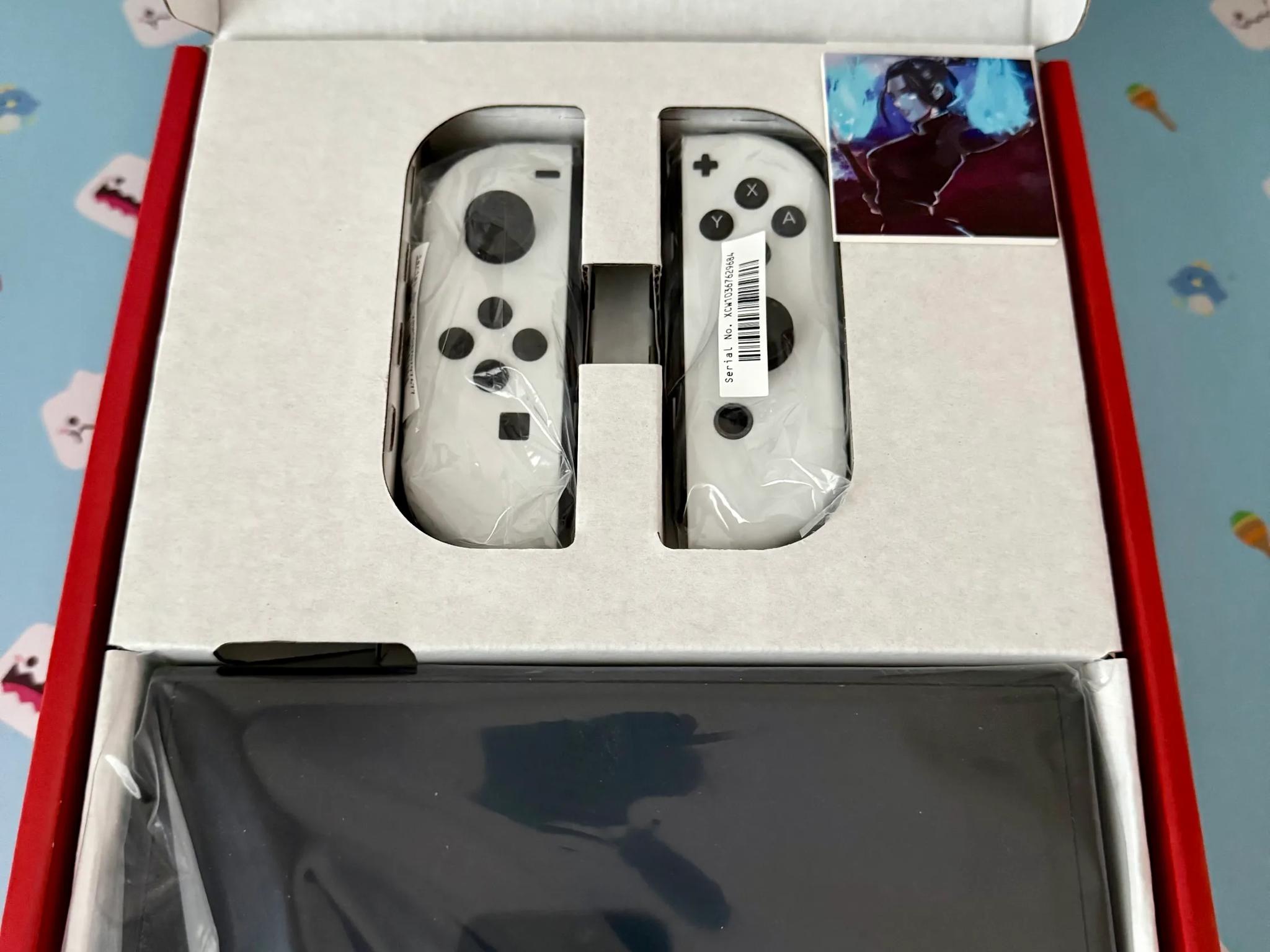 Nintendo Switch – OLED Model w/ White Joy-Con