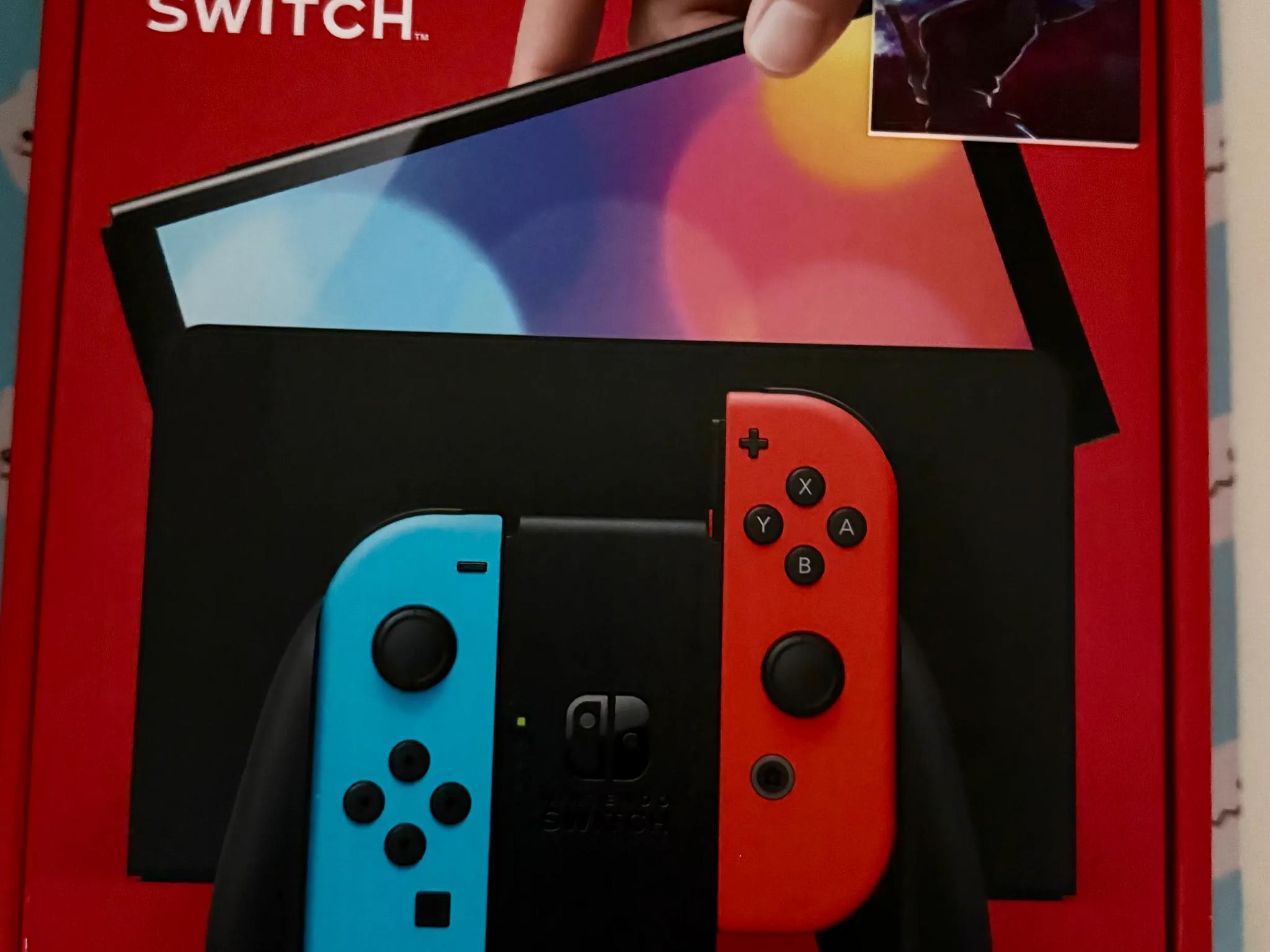 Nintendo Switch – OLED Model w/ Neon Red & Neon Blue Joy-Con