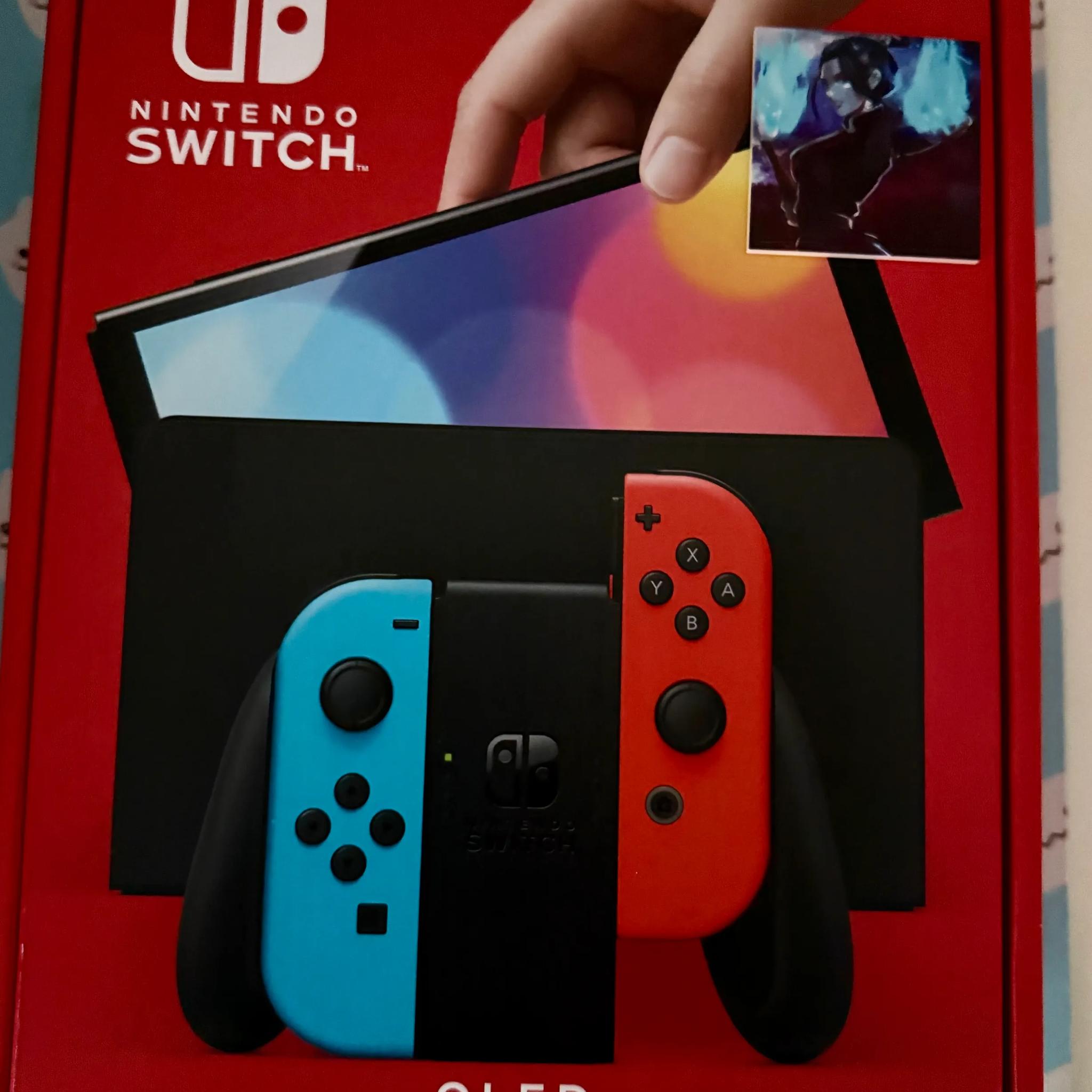 Nintendo Switch – OLED Model w/ Neon Red & Neon Blue Joy-Con
