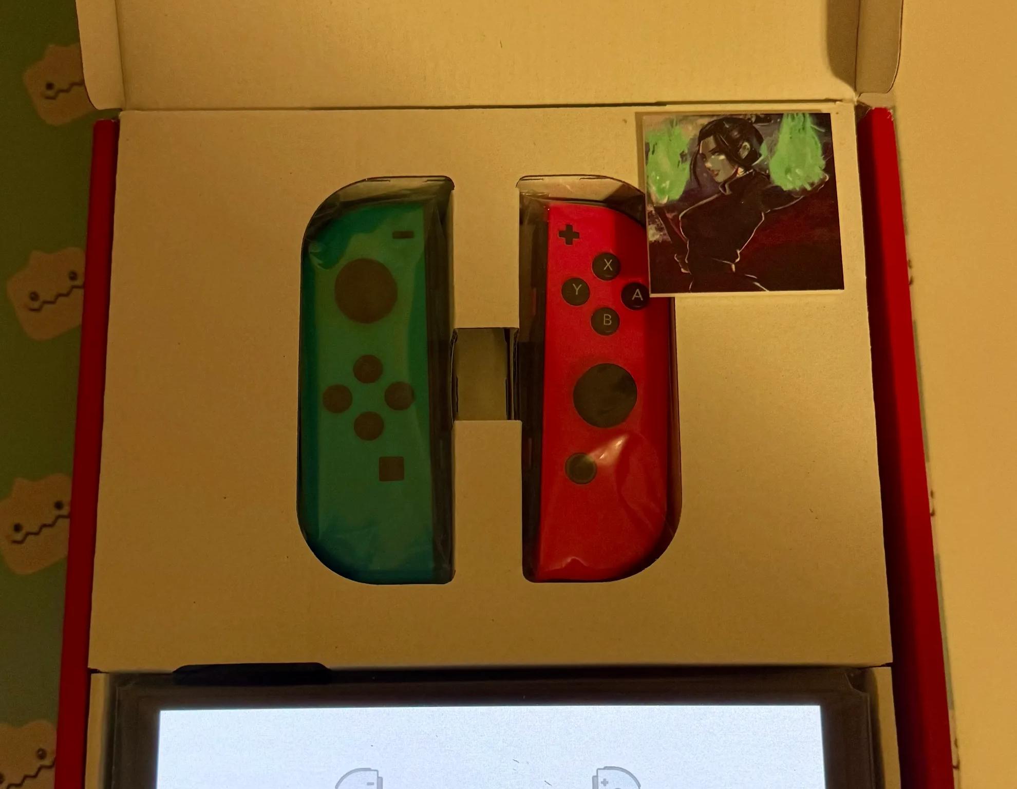 Nintendo Switch – OLED Model w/ Neon Red & Neon Blue Joy-Con