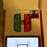 Nintendo Switch – OLED Model w/ Neon Red & Neon Blue Joy-Con