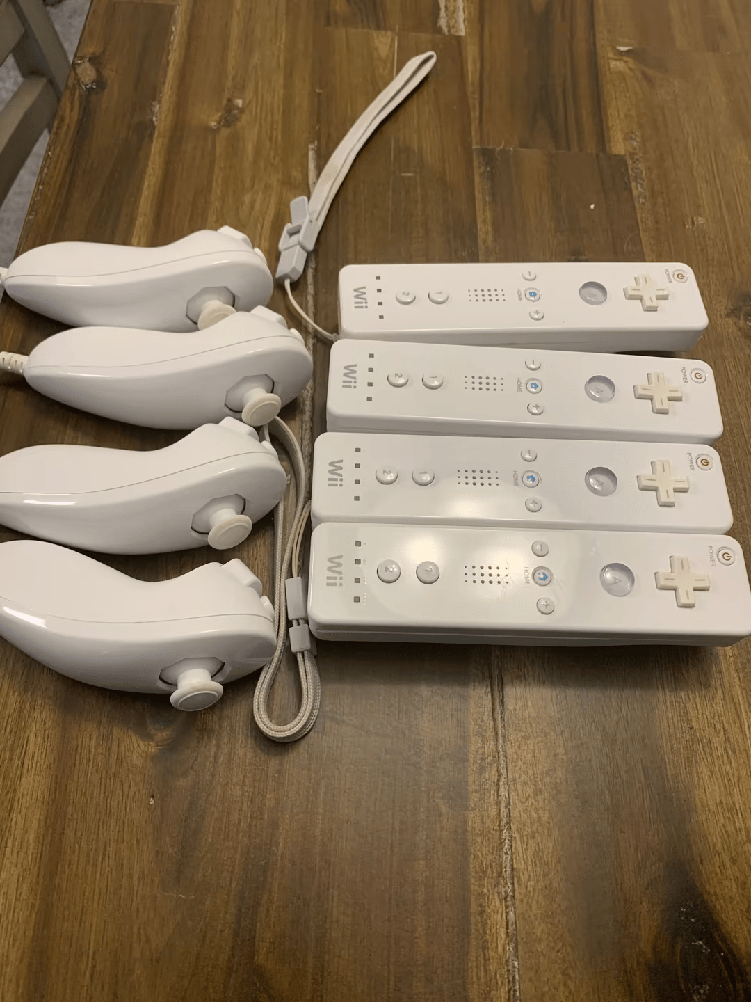 (4) Wii Remotes w/ Nunchuks