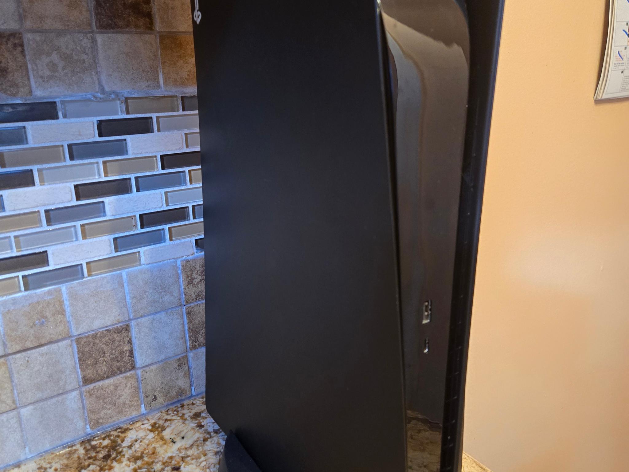 PS5 (Black Plates, Camo Controller) + God of War Ragnarök – $370