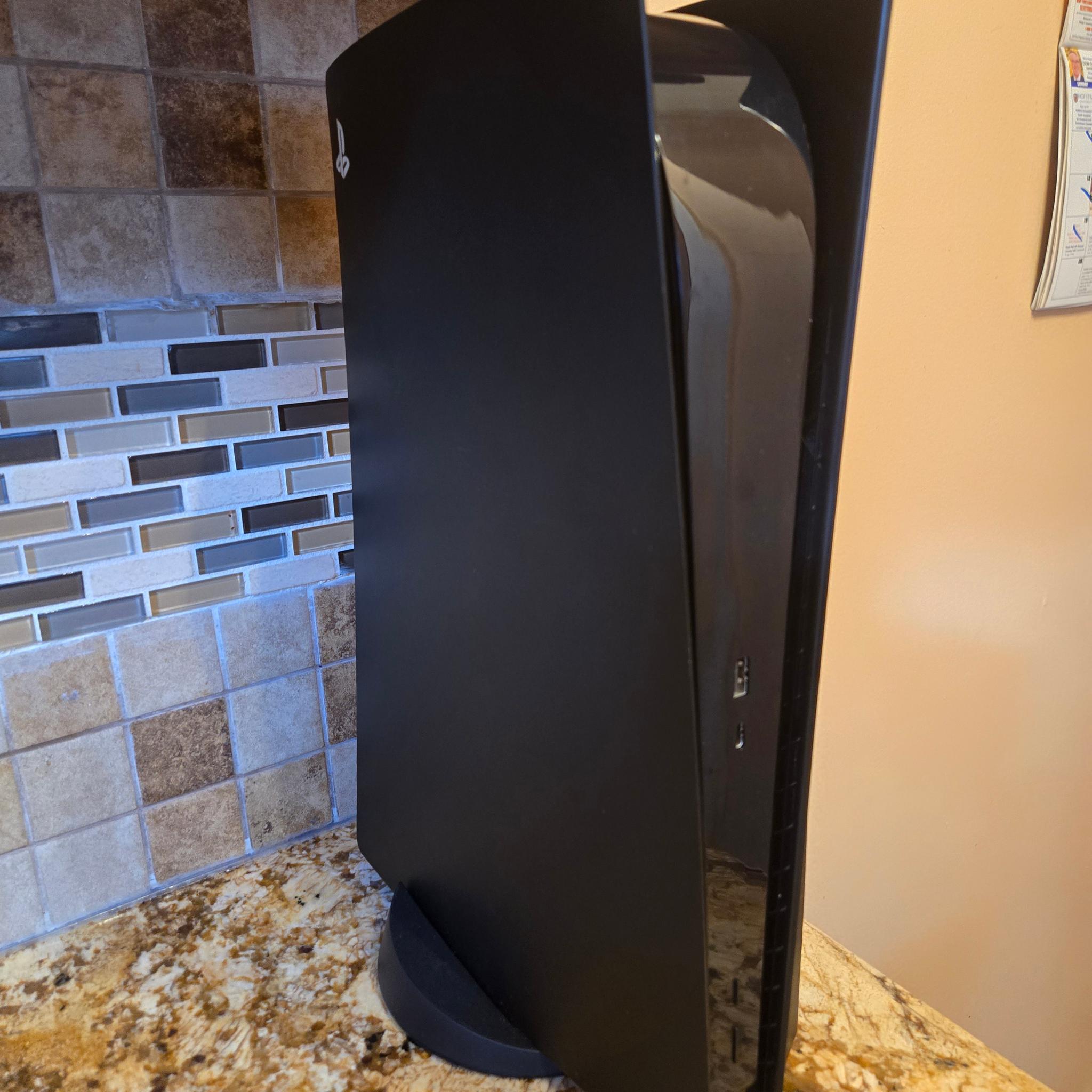 PS5 (Black Plates, Camo Controller) + God of War Ragnarök – $370
