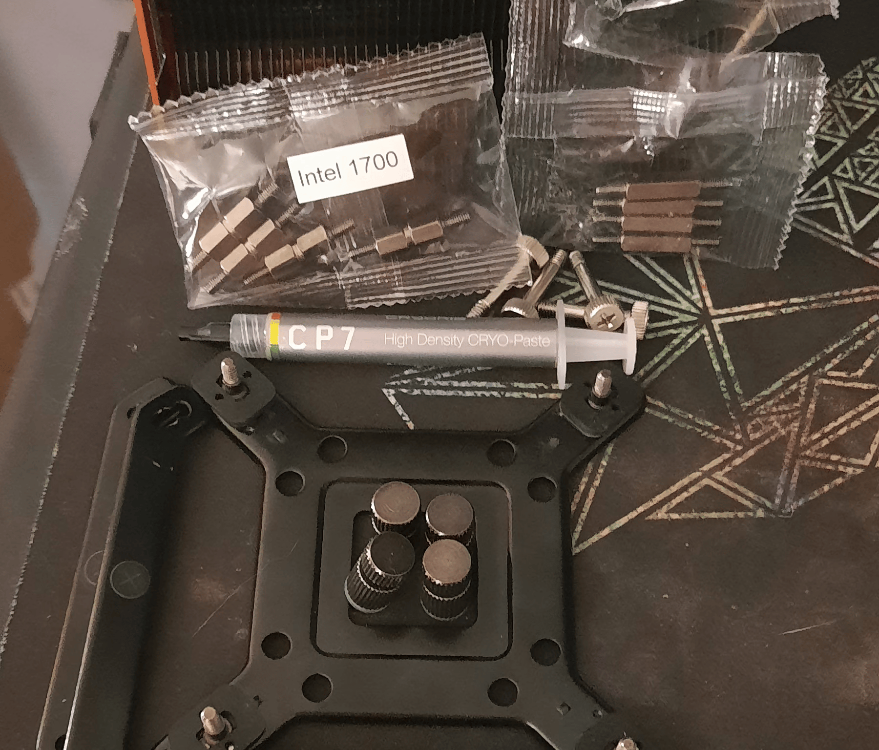 Cryorig R1 CPU cooler with orange and original cover