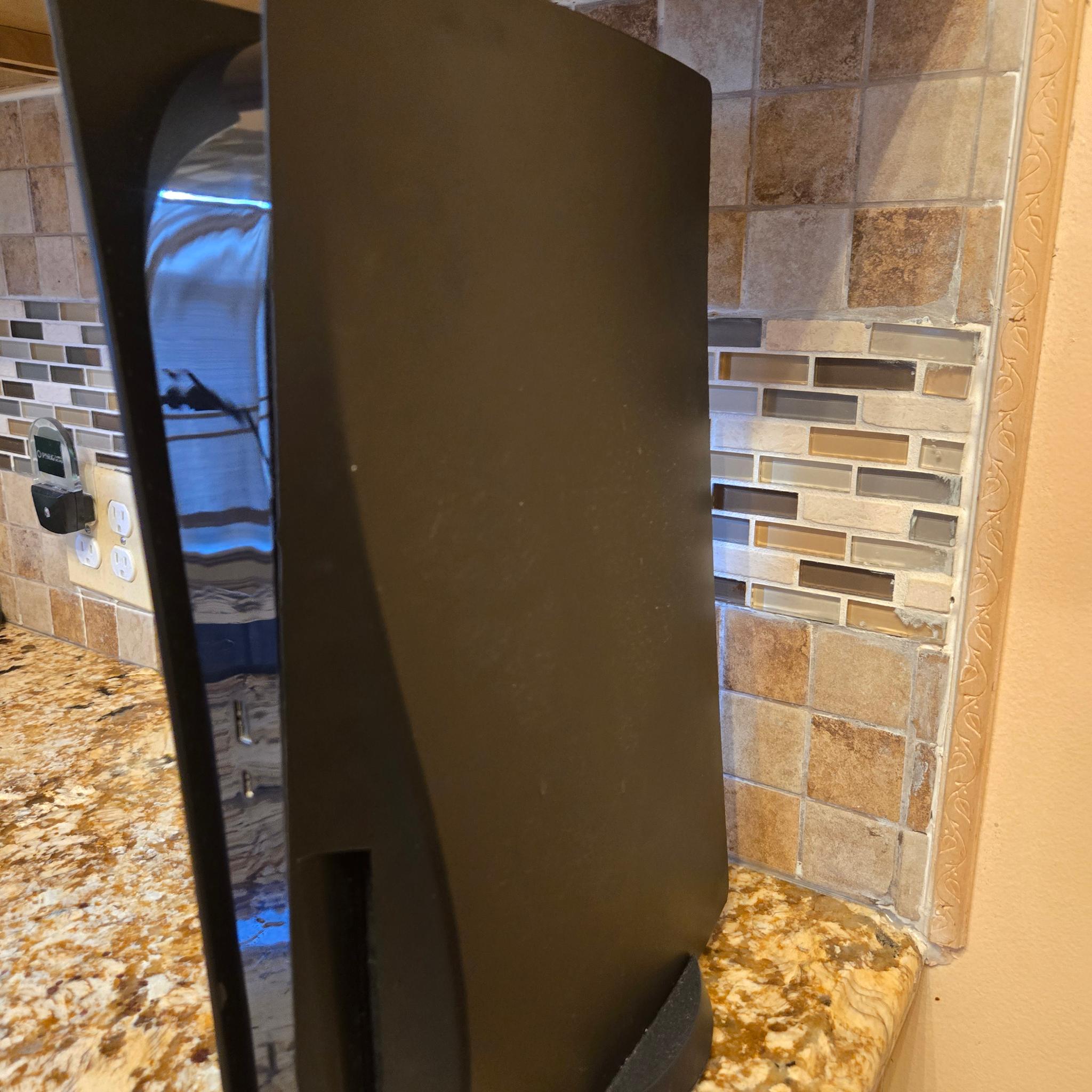 PS5 (Black Plates, Camo Controller) + God of War Ragnarök – $370