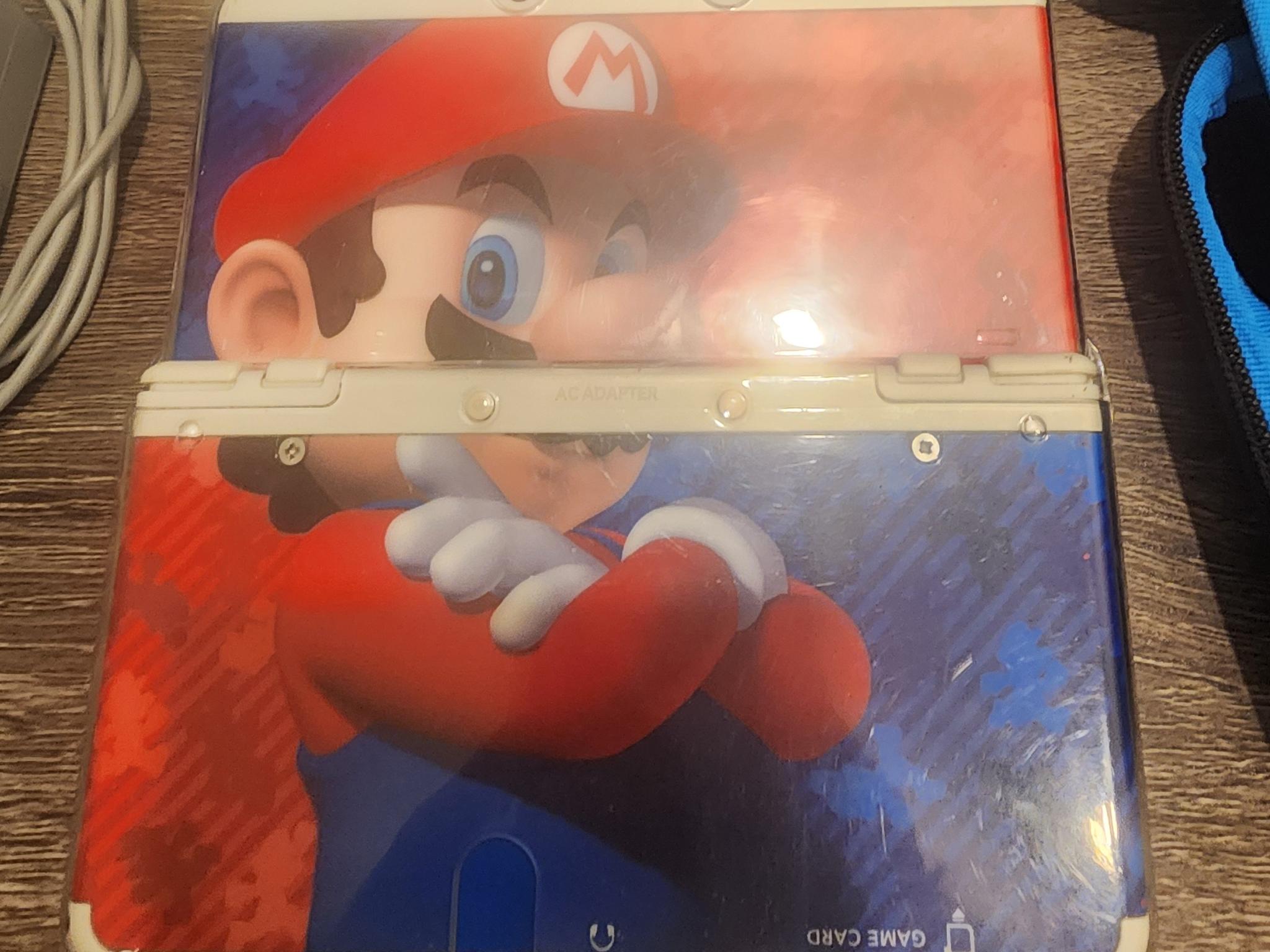 New Nintendo 3DS (Non-XL), Games, Case, 2 chargers, and clear case on console, 32gb microSD